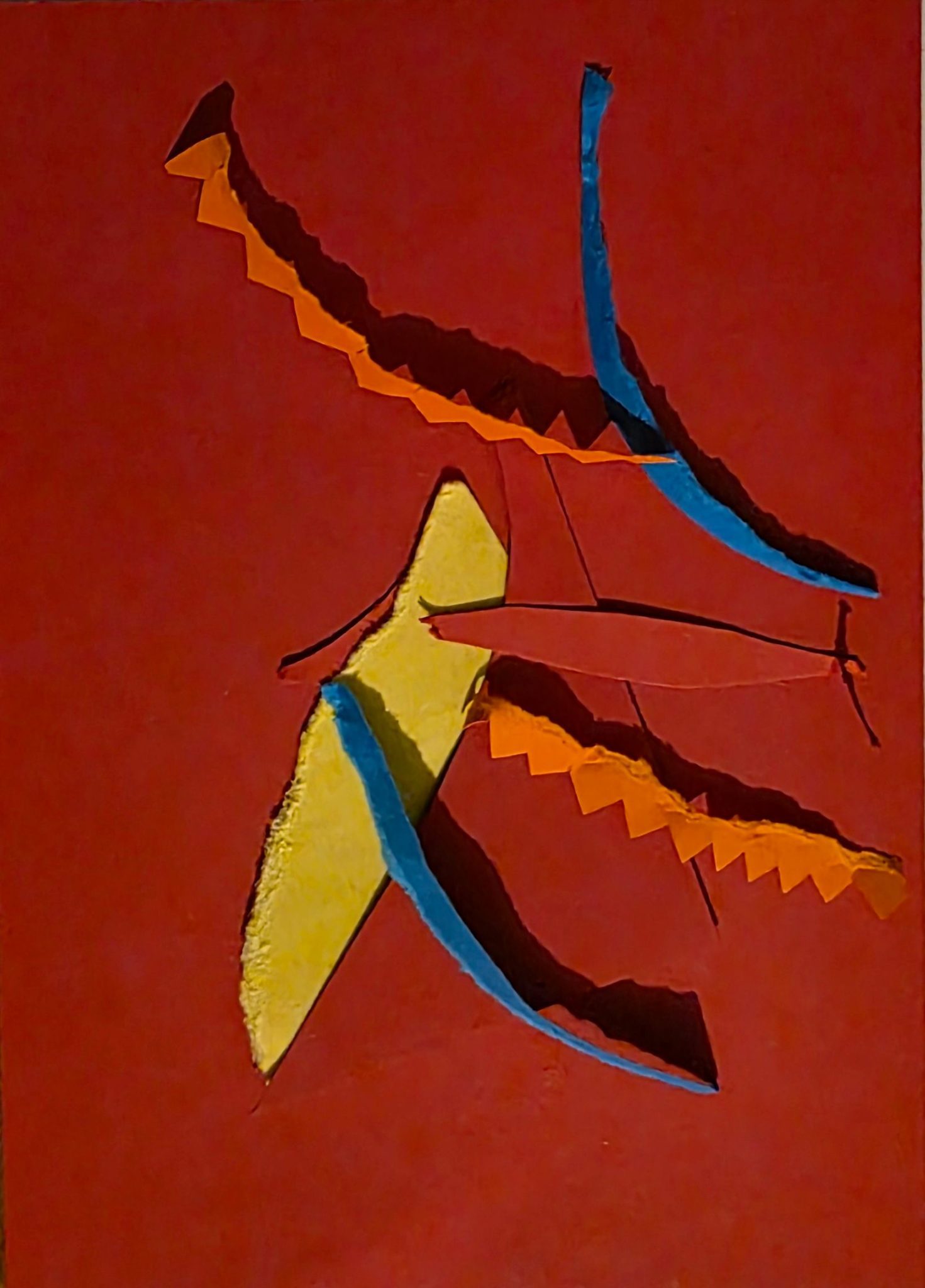 A red base with yellow, orange and blue shapes