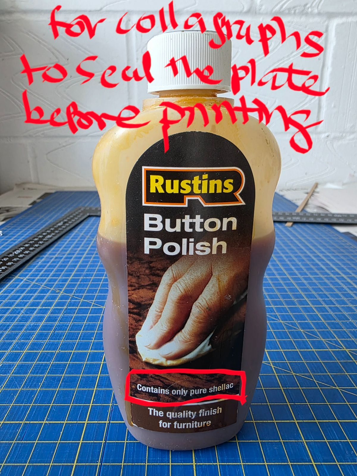 A picture of a bottle of button polish with writing above