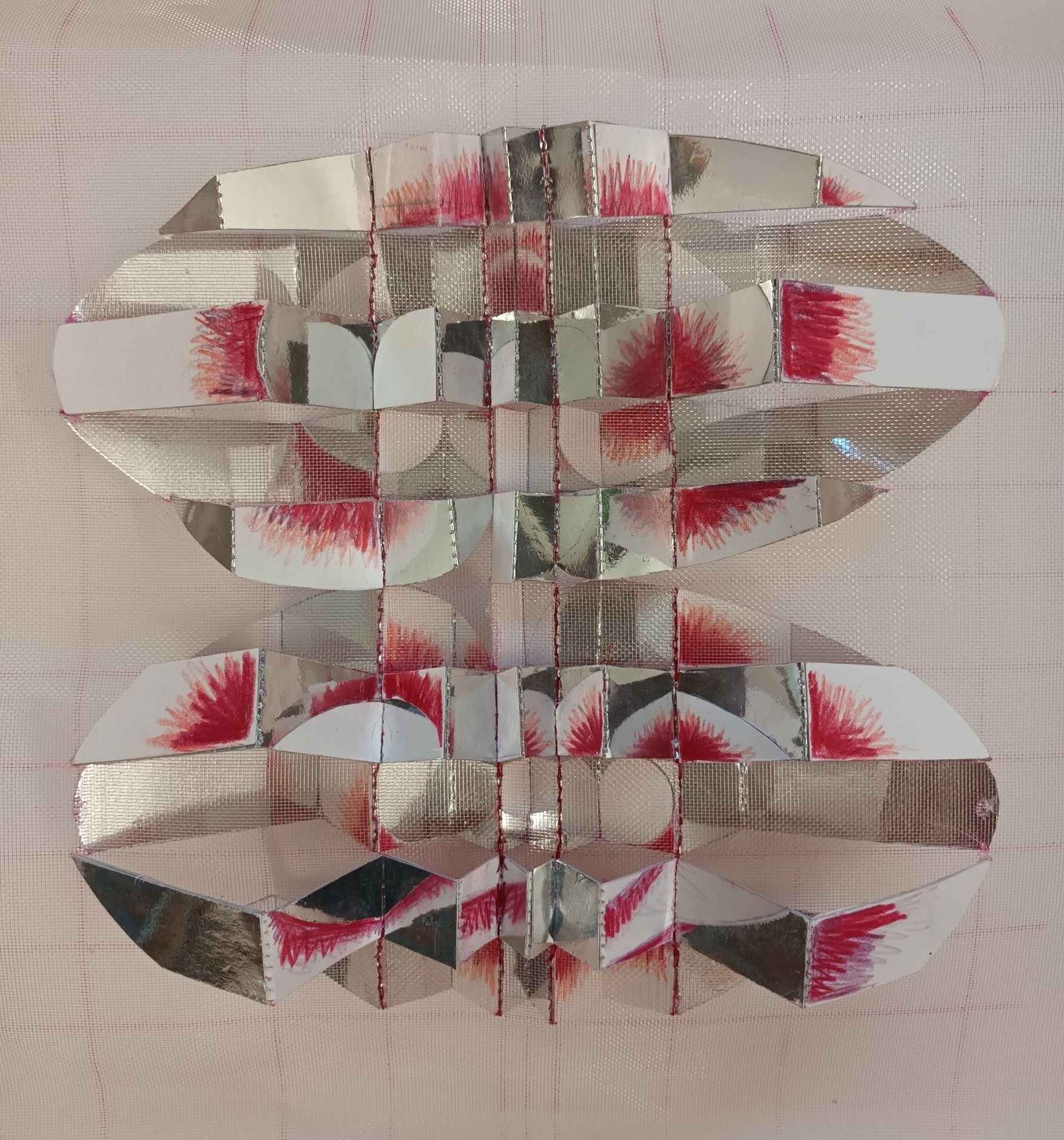 Mirrored spiral shape with mirror card and pencil shading. Hand sewn onto nylon gauze.