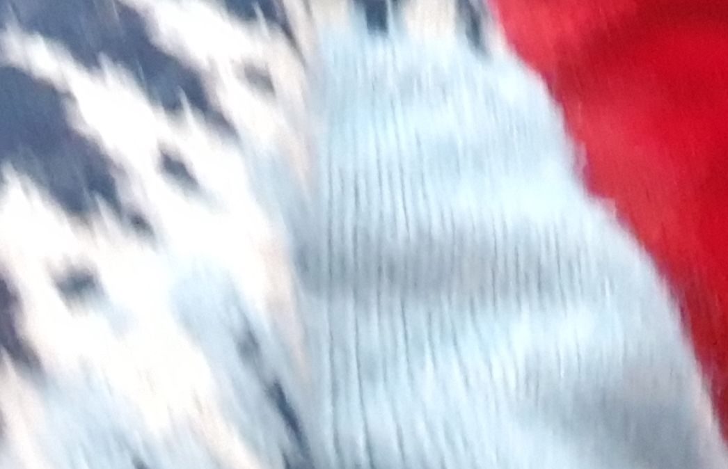 Small section of fairisle jumper and red jumper