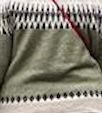 rear view of fairisle jumper and red strap