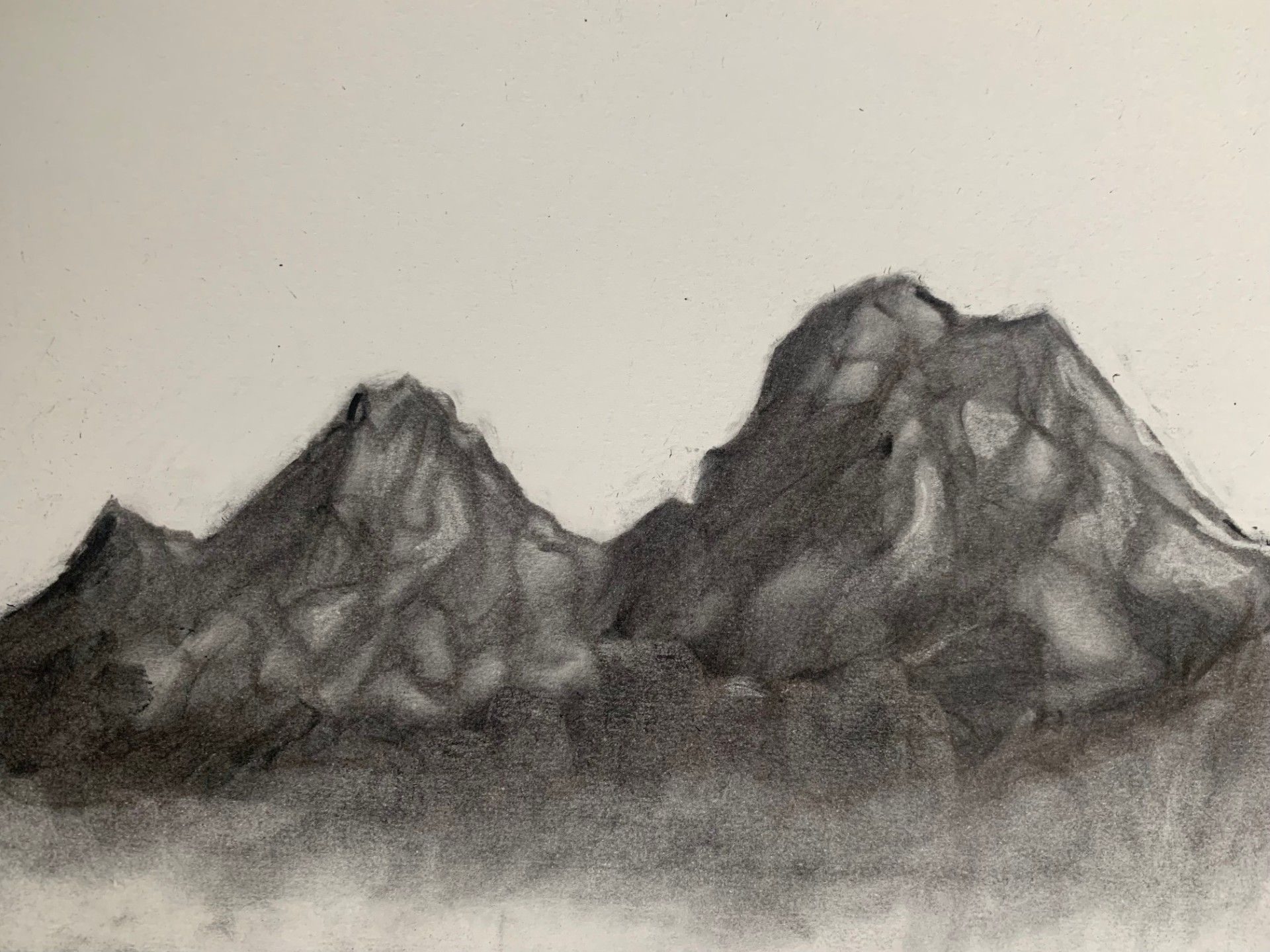 A charcoal drawing of a mountain range