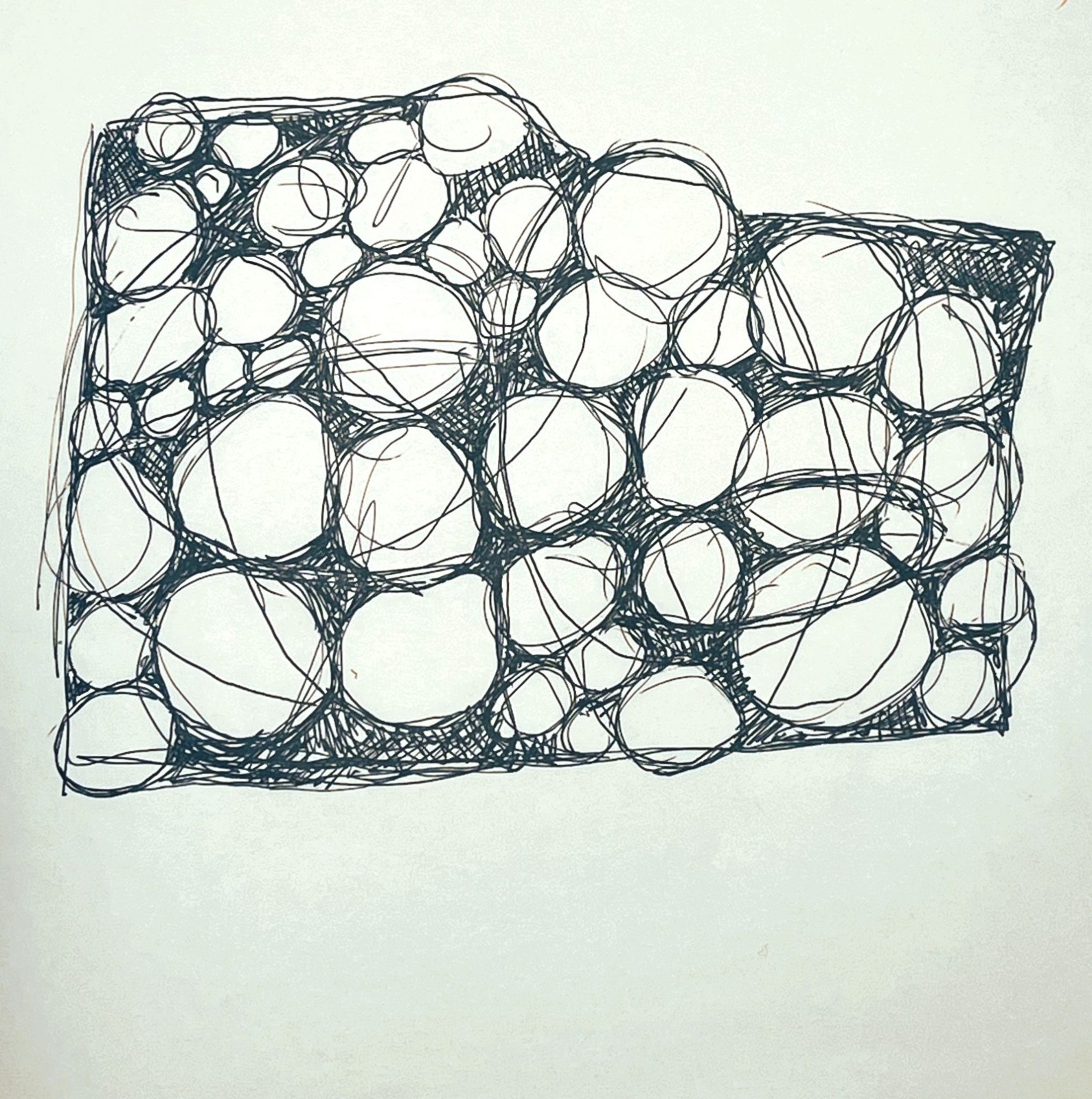 black fine liner pen scribbles of circles all piled up
