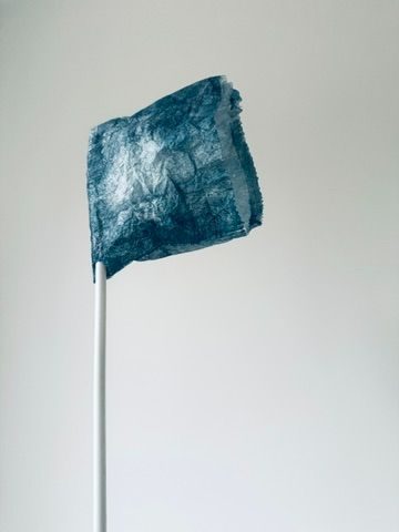 monoprinted paper bag in indigo with white straw handle