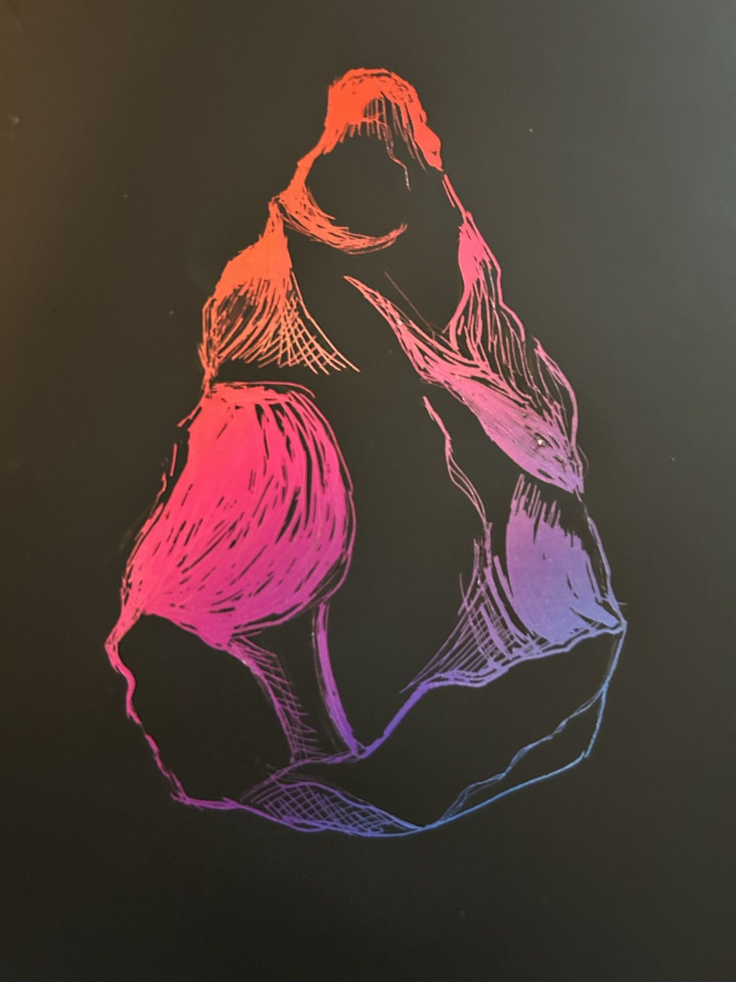 A drawing of an ancient hand axe done on scratch off foil revealing rainbow colours underneath