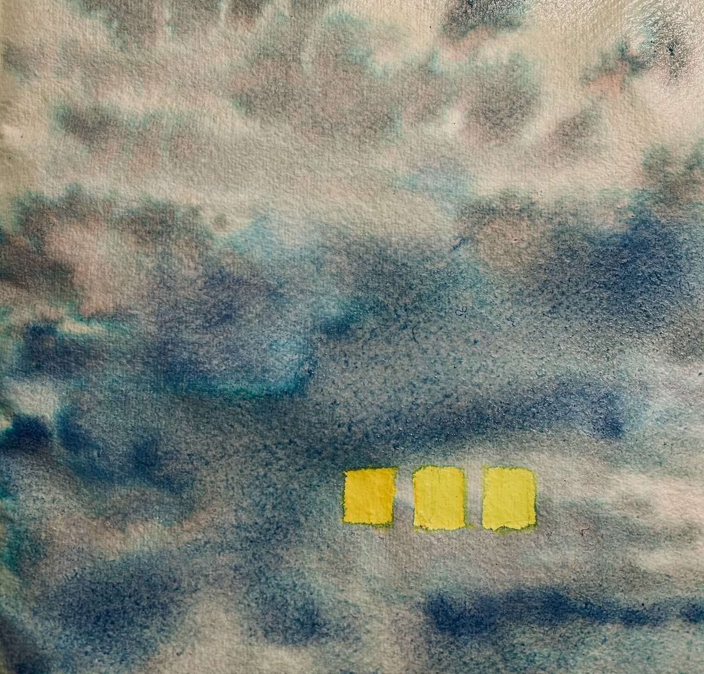 Three yellow squares surrounded by grey and blue ink