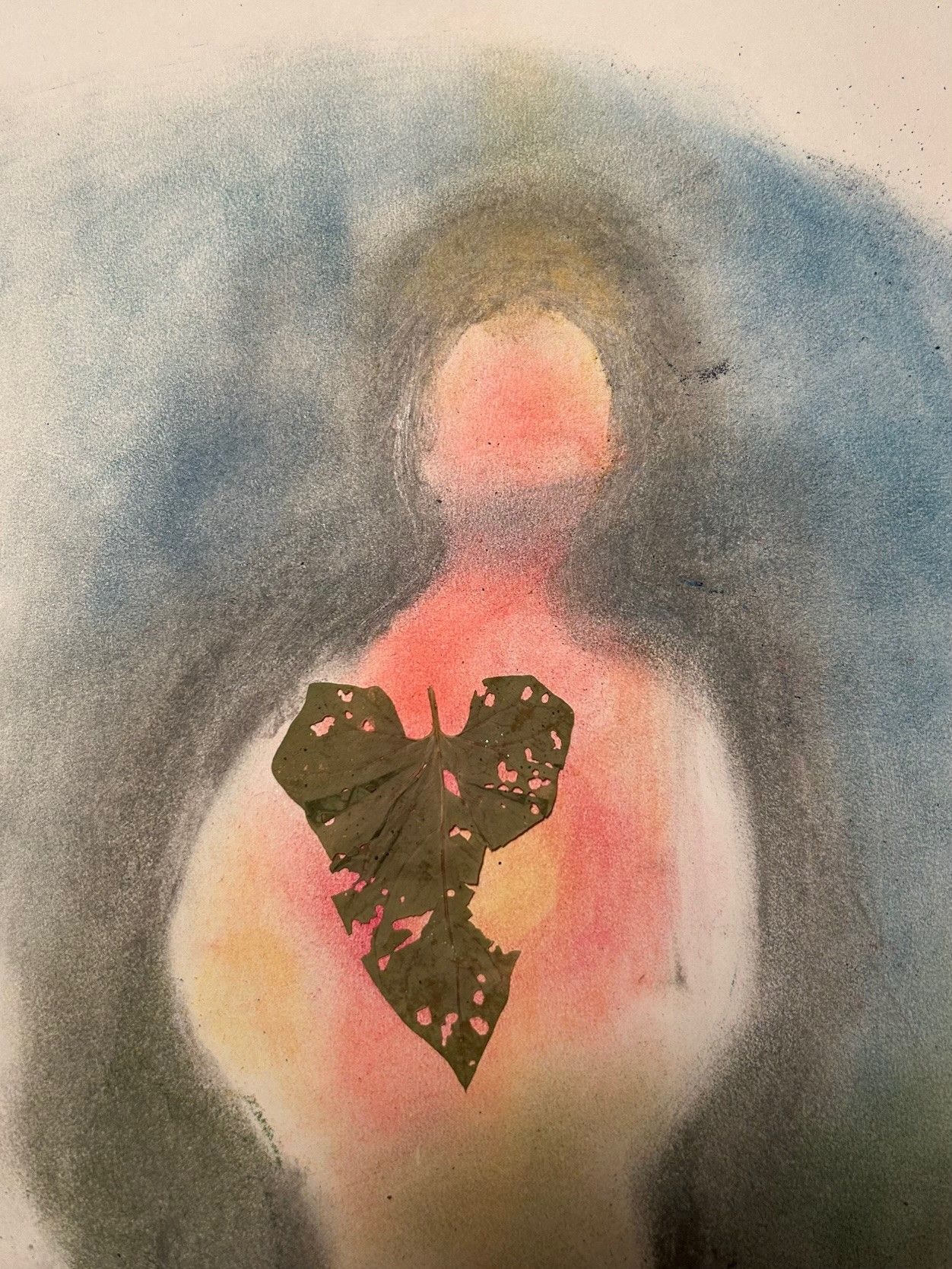 A nibbled pressed bindweed leaf overlayed a pastel shape of a torso with a shining heart area