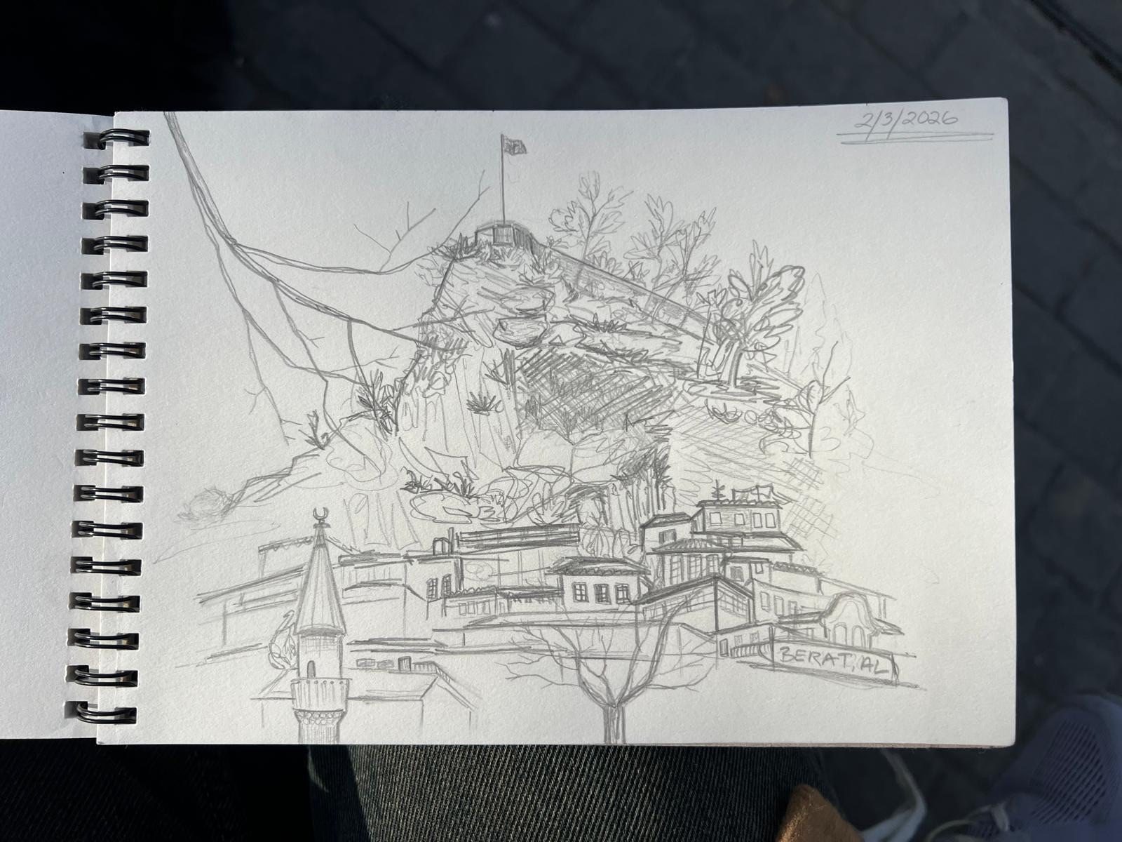Sketch of a hillside town with trees and buildings