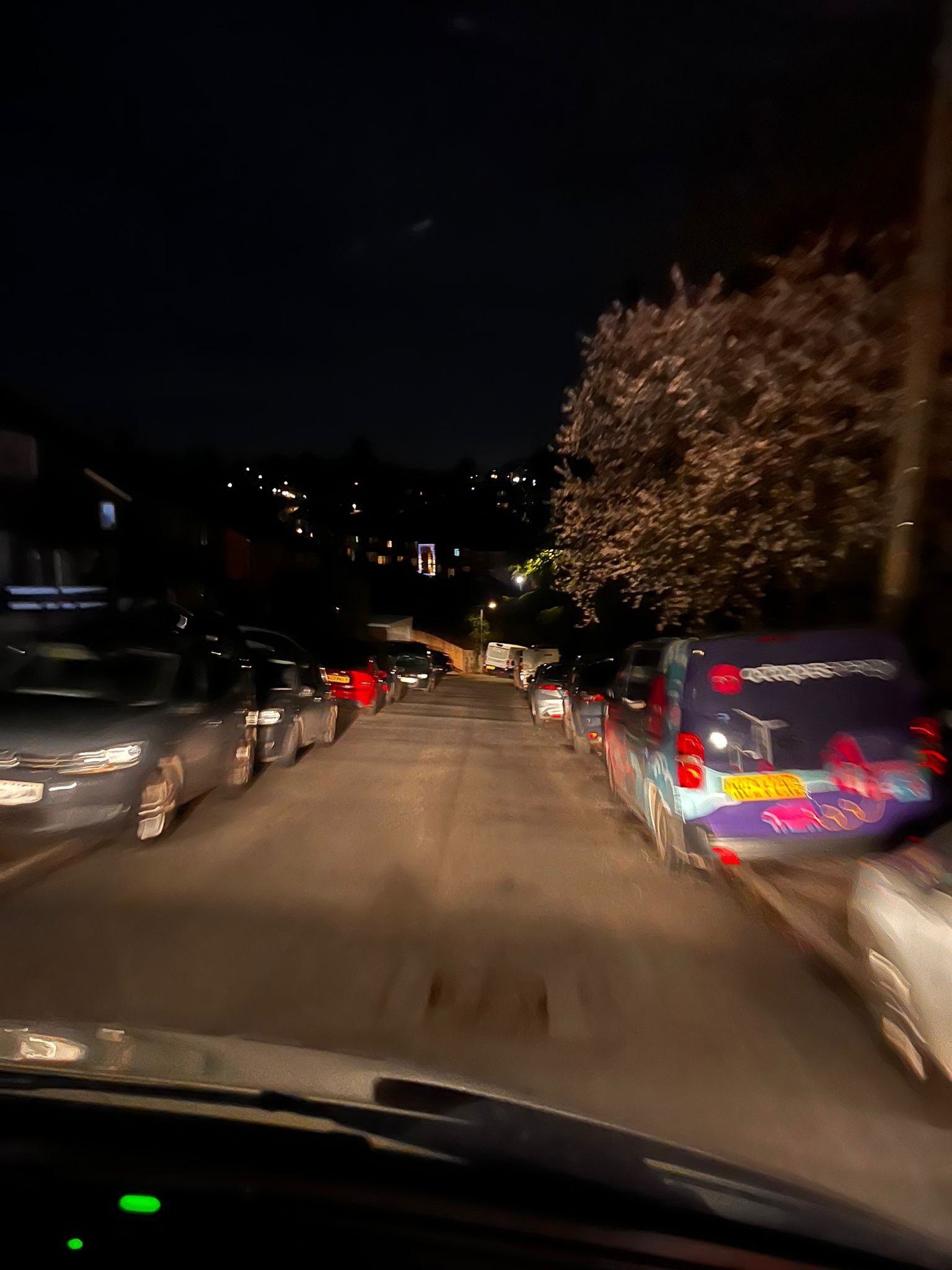 A blurry picture of a road at night