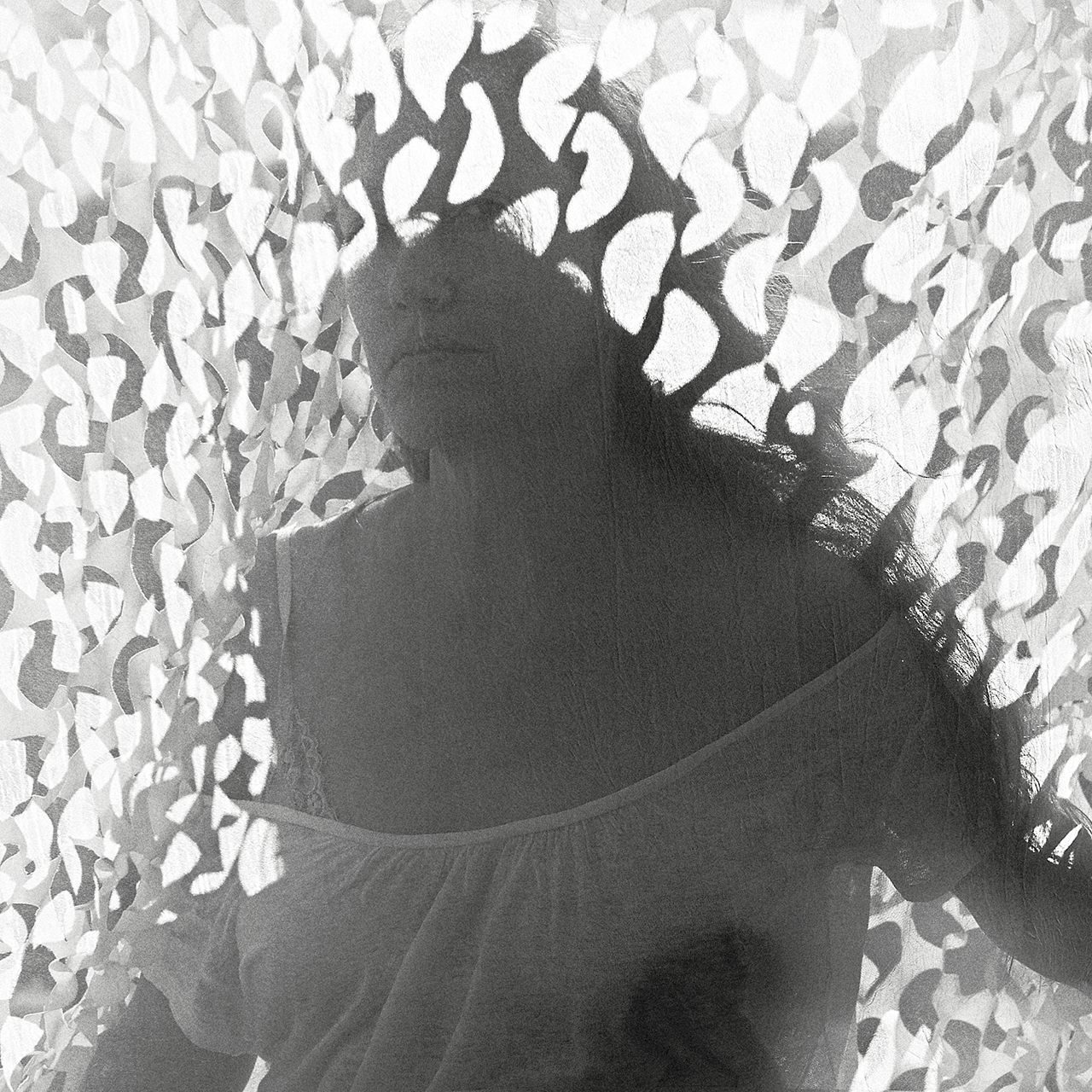 self-portrait through a curtain