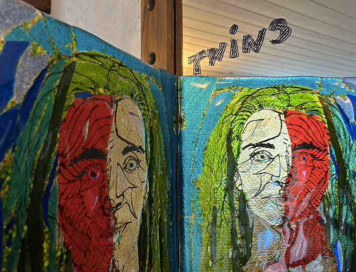 glass portrait of woman  - held up to mirror to look like two people TWINS