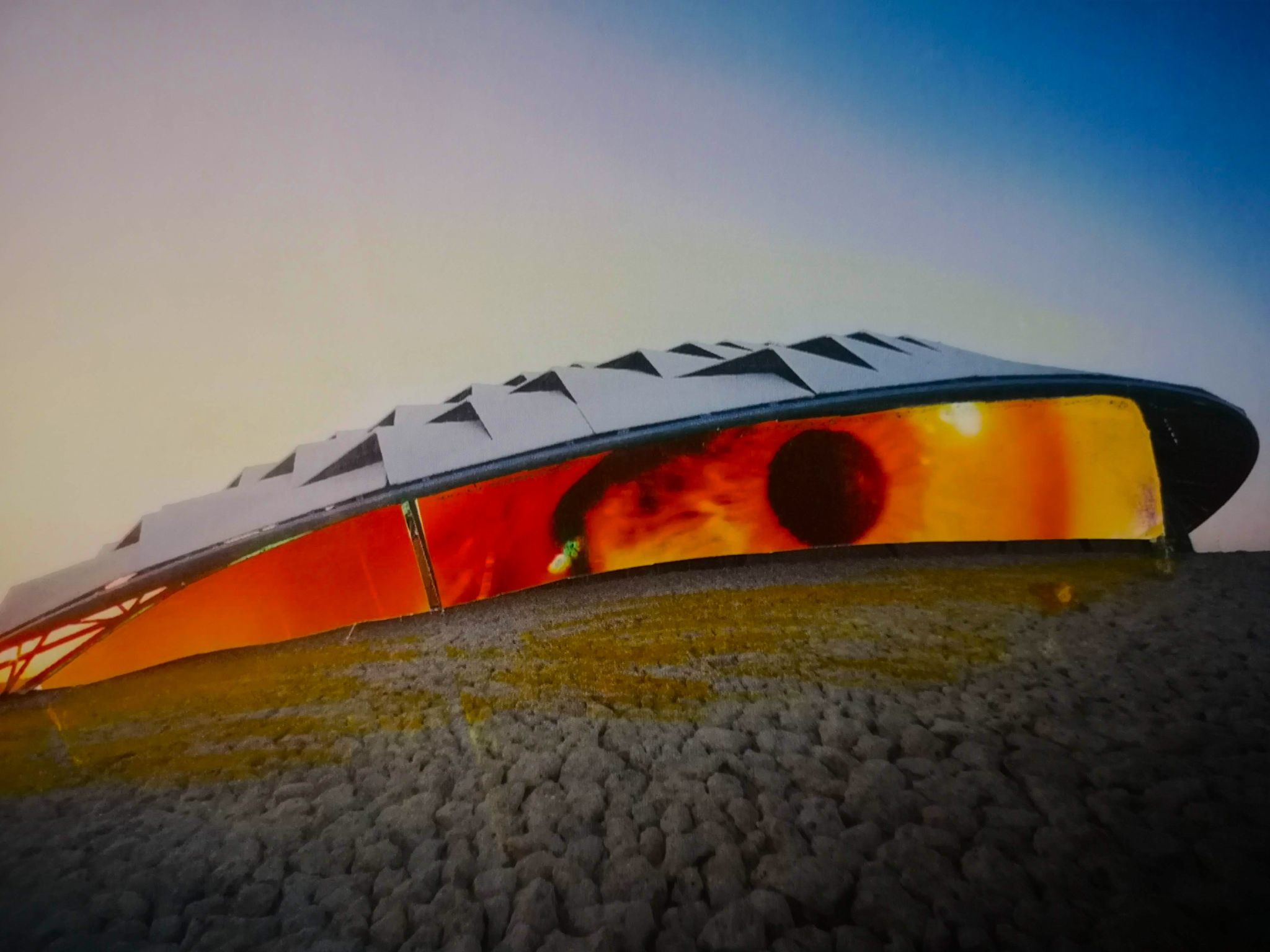 a collage of a building on the horizon, with an interior filled with a human eye - very spooky