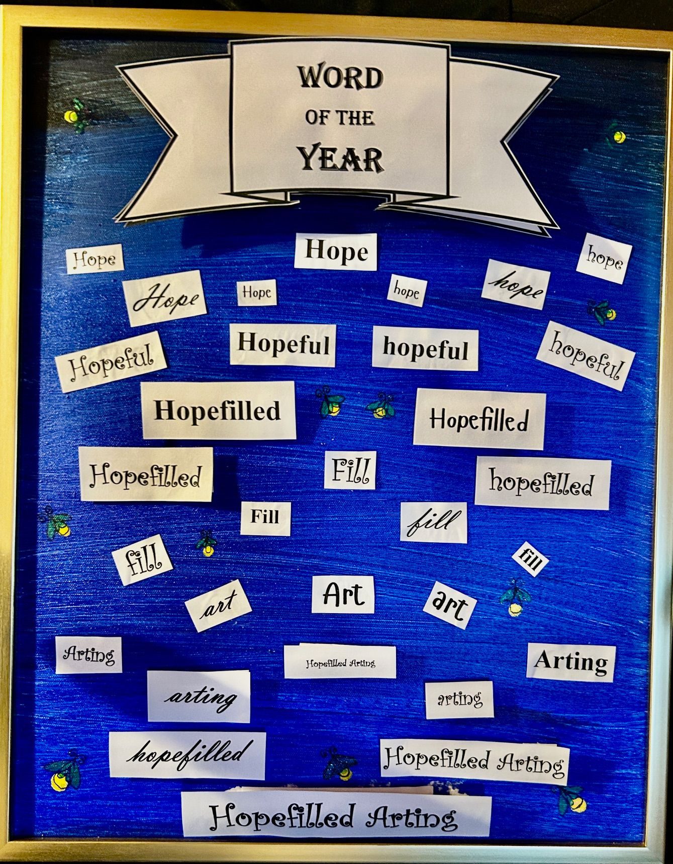 The words hope, hopefilled, art and arting are cut and taped in 3-D to a rich blue background