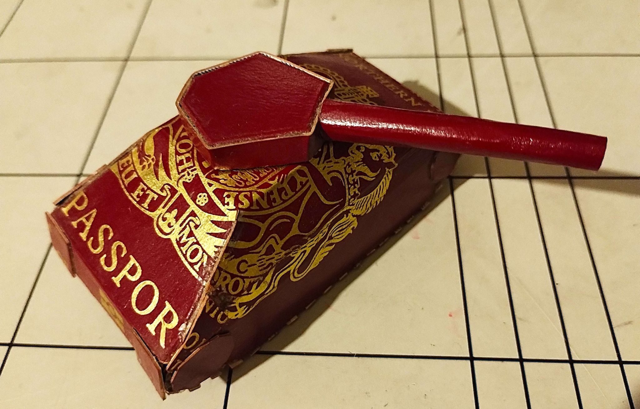 'Border' is a tiny sculpture of a tank, made from a UK passport cover