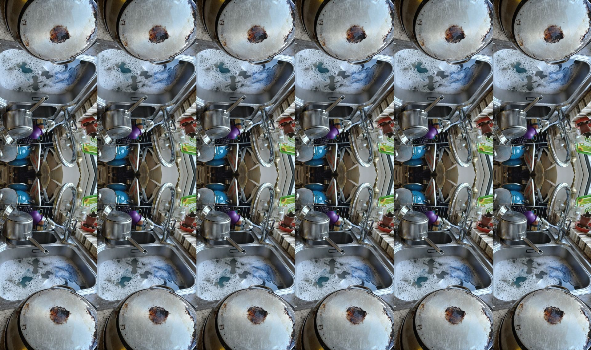 A photograph of washing up, clean and piled up was repeated and ended up looking like tin pan drums and brass instruments - saucepans and taps in the mêlée gave this effect.  The idea is that the washing up is just about done.