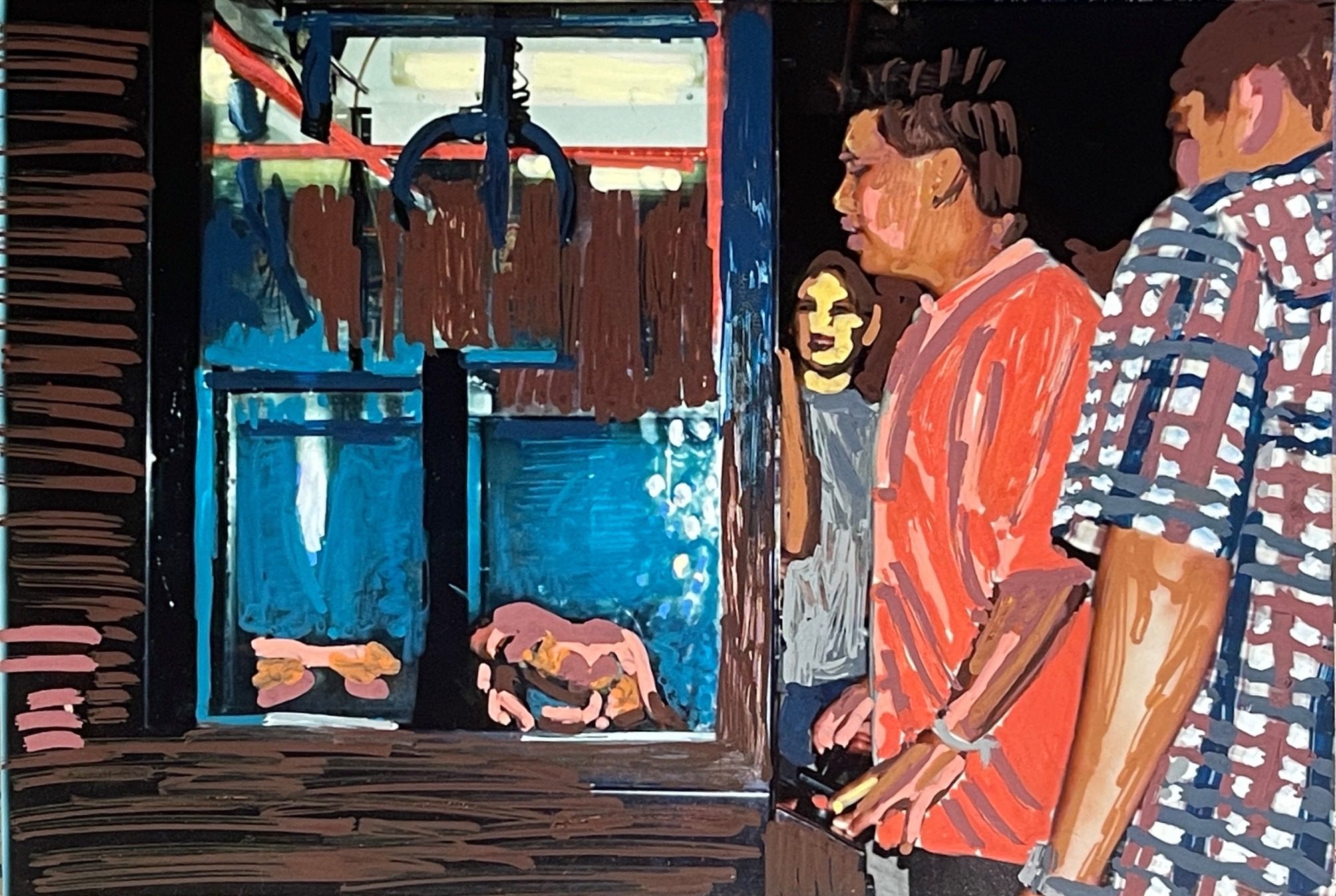 A young guy with friends looking on operates a claw arcade machine to choose and pick up a crab in a tank.