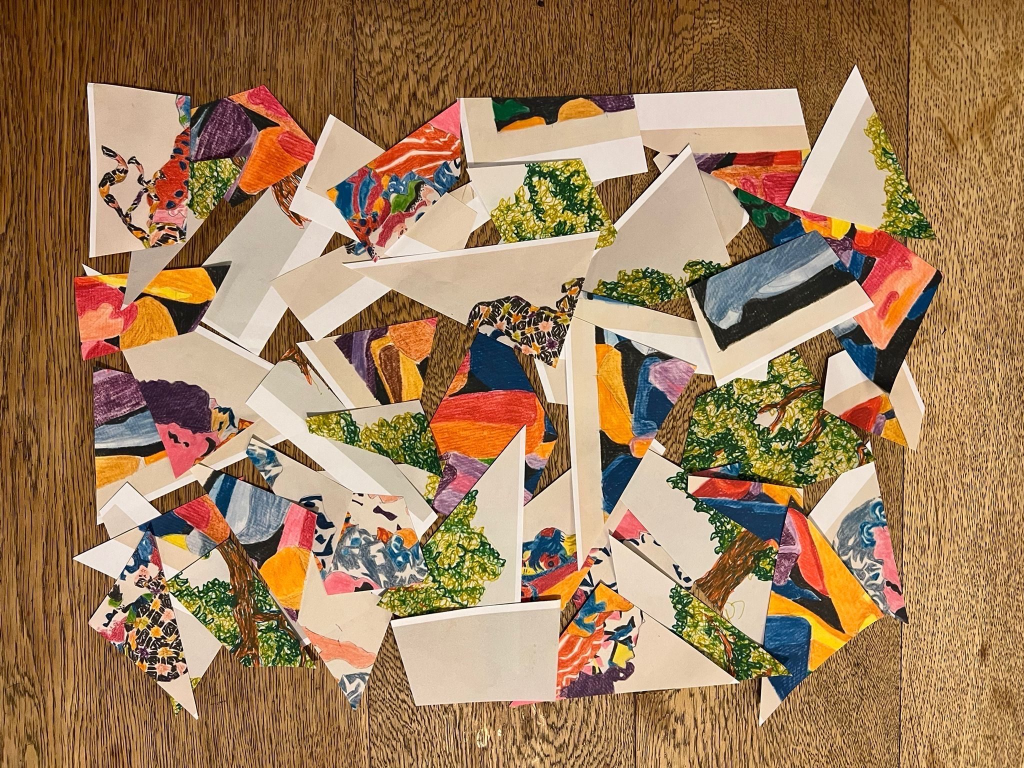 Three coloured pencil drawings cut to pieces and mixed together