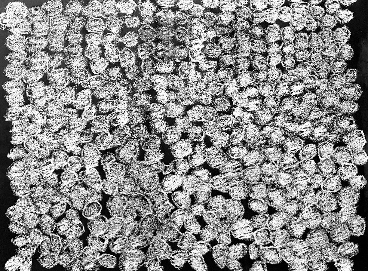 A black field covered in crudely drawn close packed white dots