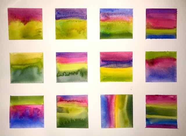 12 squares of watercolour paintings on one page using green pink and purple in different compositions mostly green in bottom half and pink and purple or ultramarine in the top half some of them with the colours bleeding into each other.