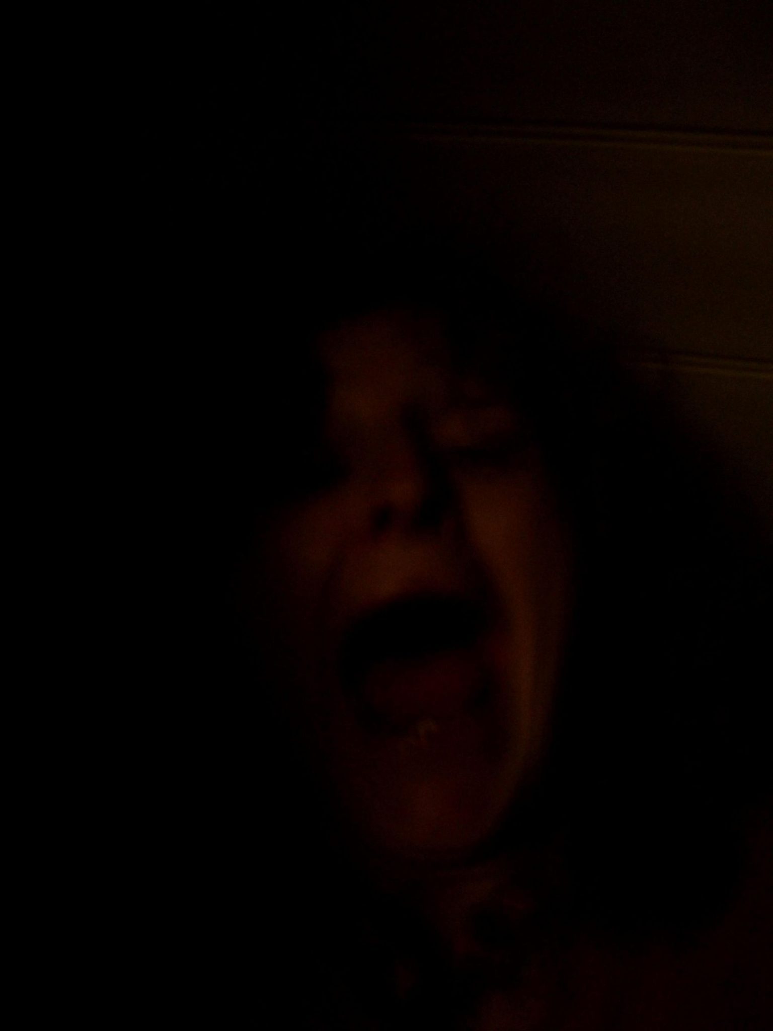 Photo in the dark someone screaming