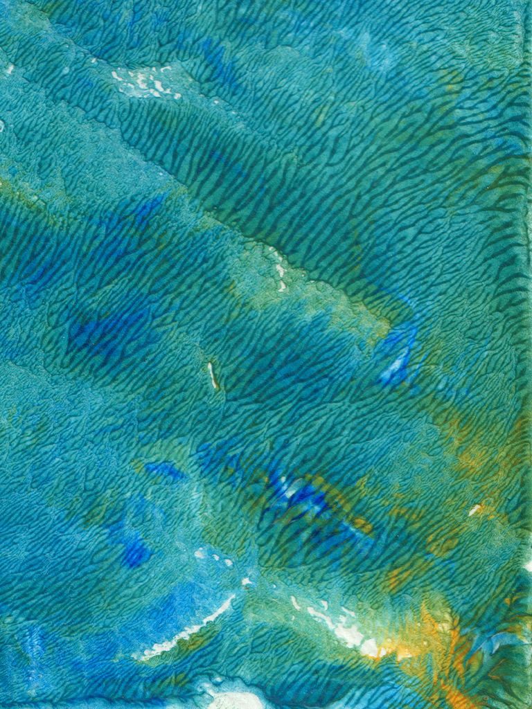 an abstract painted texture in blue and gold