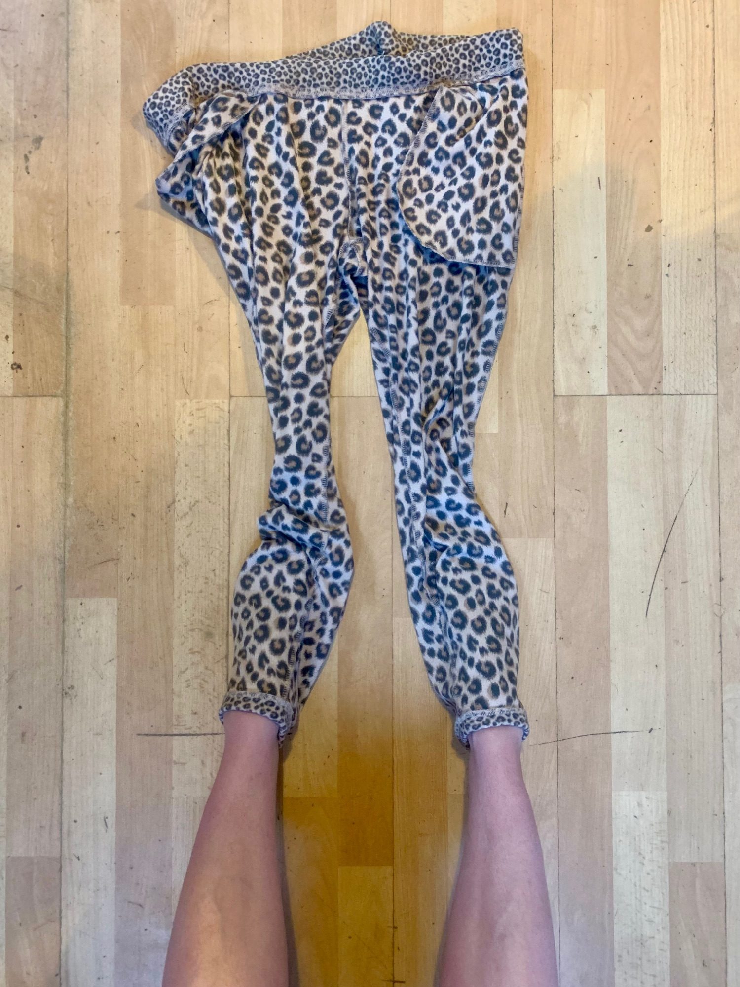 Extending my bare legs by taking my trousers off and leaving them inside out and still attached to my ankles.