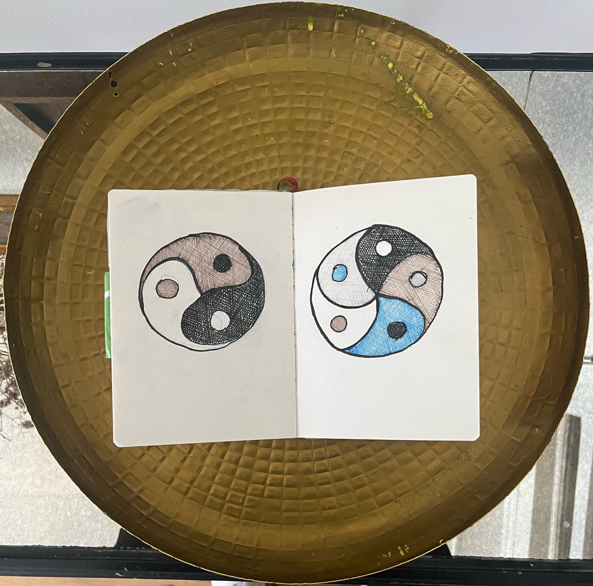 Drawing of two circular symbols based on the yin yang.
