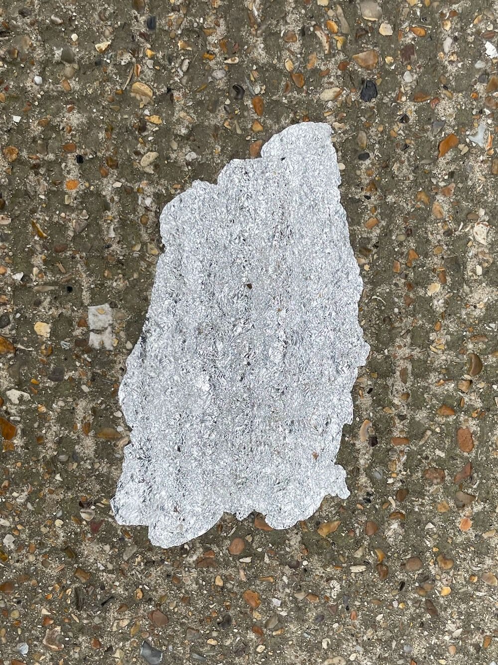 Foil squashed to pavement