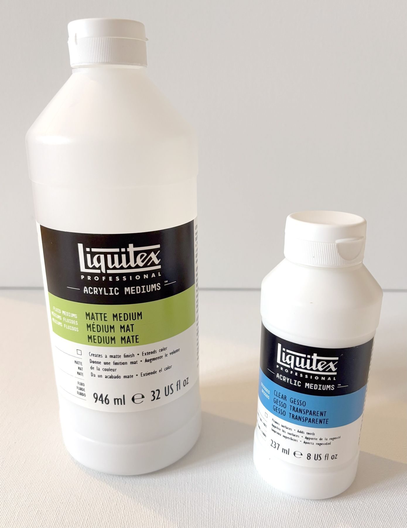 A bottle of matt medium and a smaller bottle of clear gesso.