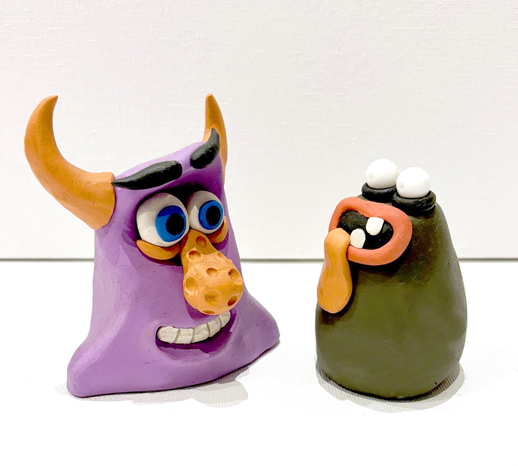 Plasticine sculpts of creatures.