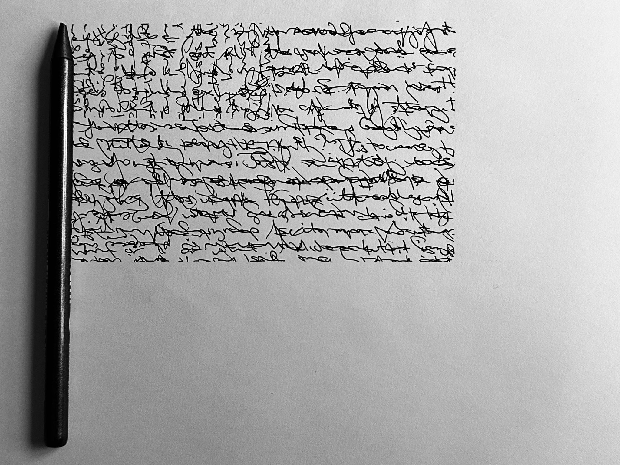 Unreadable writing in black pen on white page in rectangle shape to represent a flag with pencil at the side as flag pole