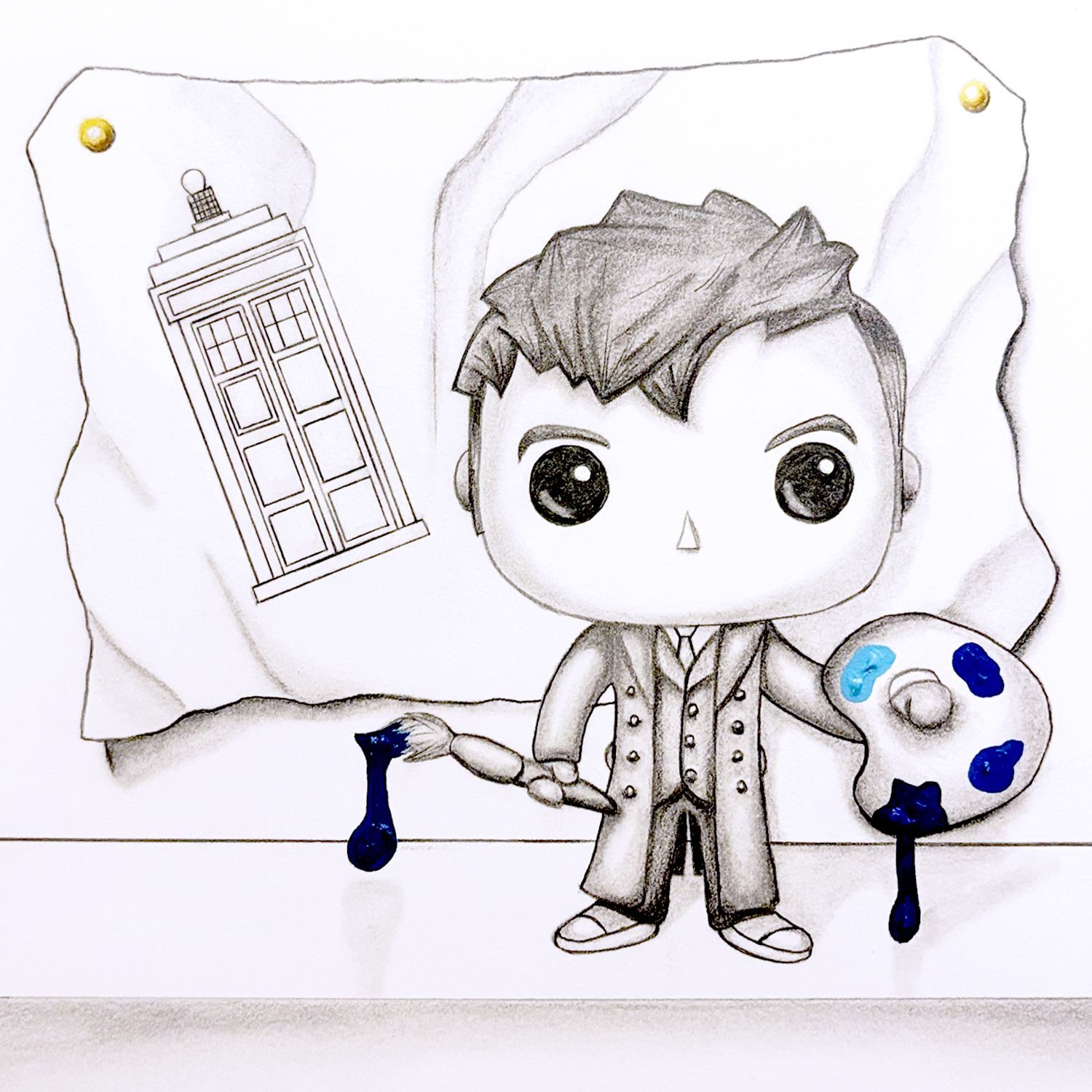 A Funko Pop drawing of David Tennant as Dr Who, holding a brush and palette, about to paint a picture of the TARDIS.