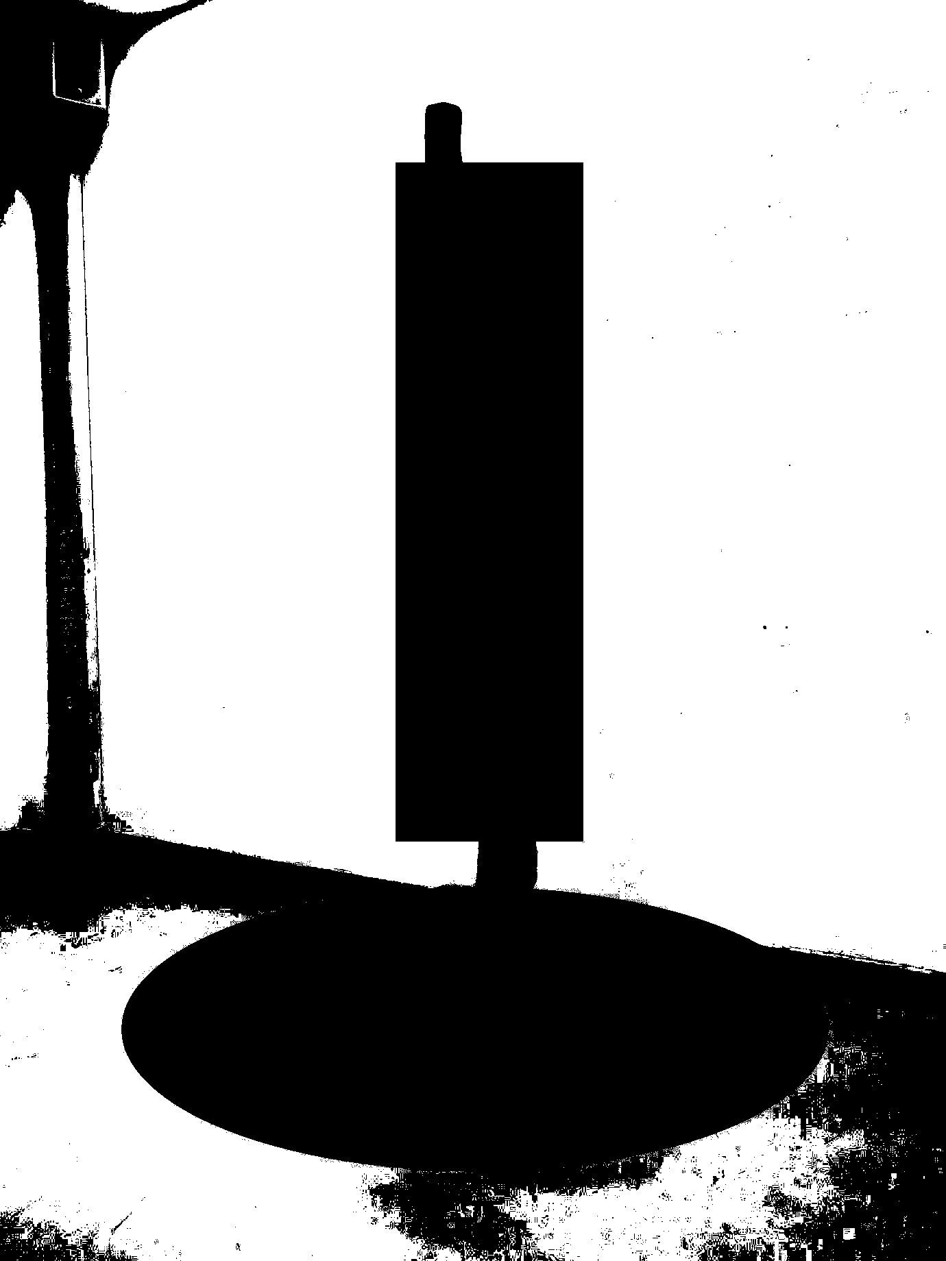 an standing sculpture in gallery redacted with a black rectangle and elipse made to look like a photocopy in black and white