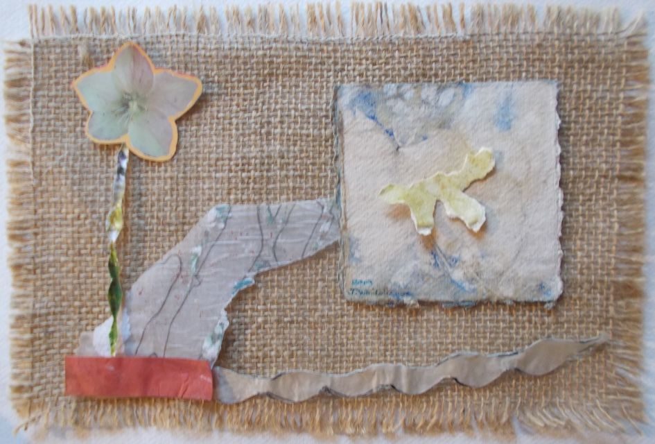 collage pieces of various materials, placed on piece of hessian