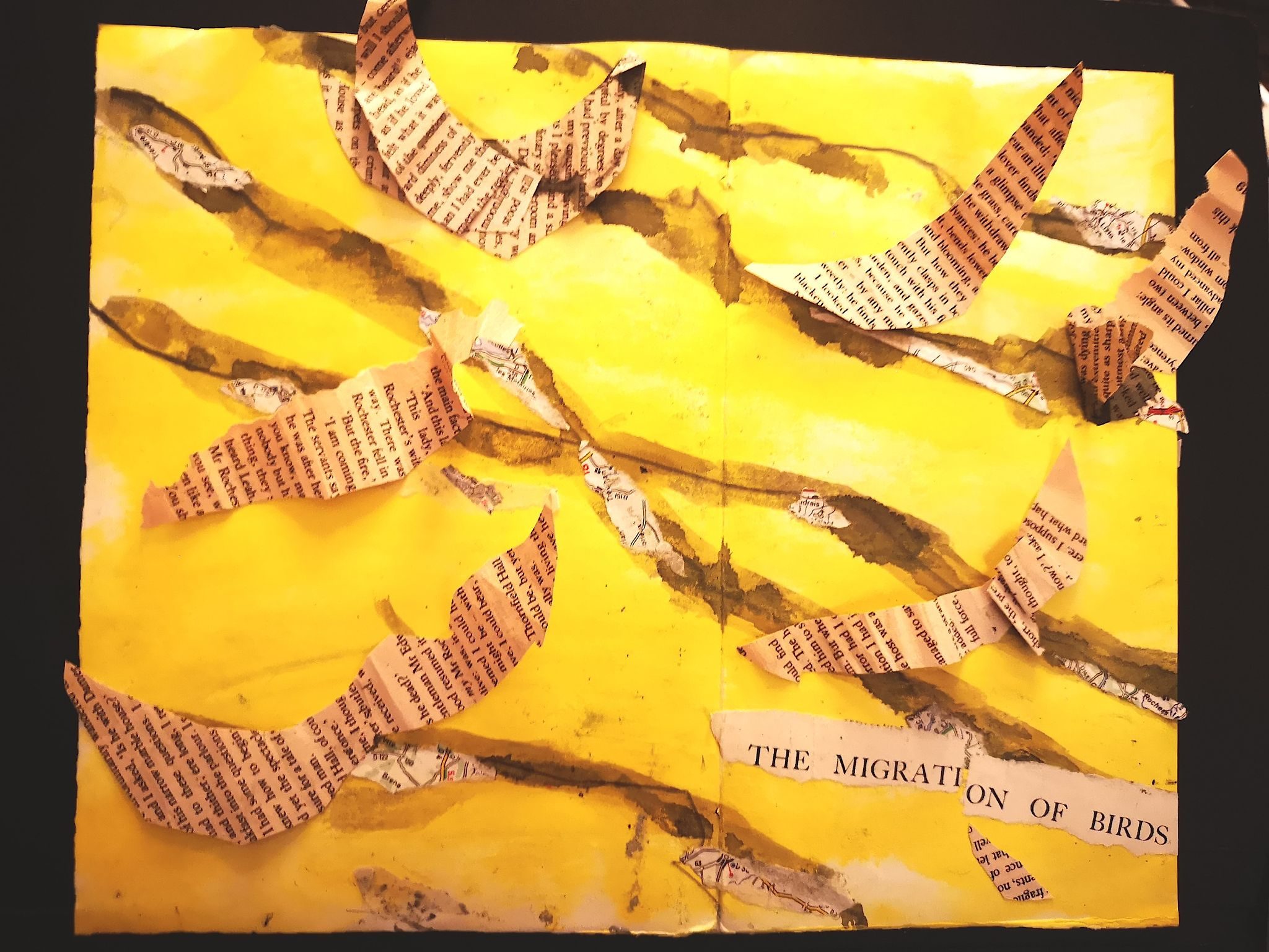 collage of bird shapes from text cut out and flying on a painted backdrop of grey/yellow