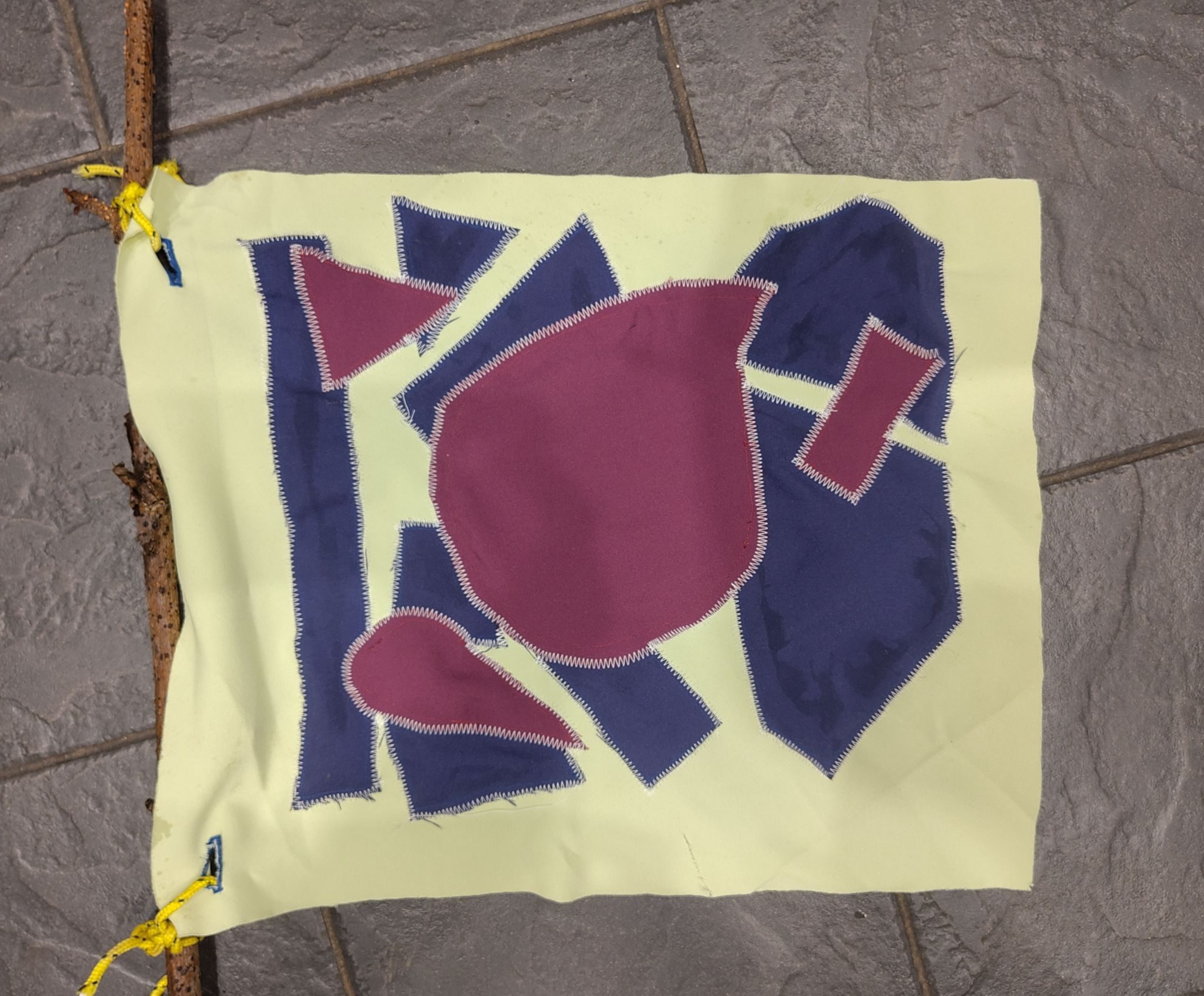 An image of flag displaying geometric shapes.  It does not stand for anything.