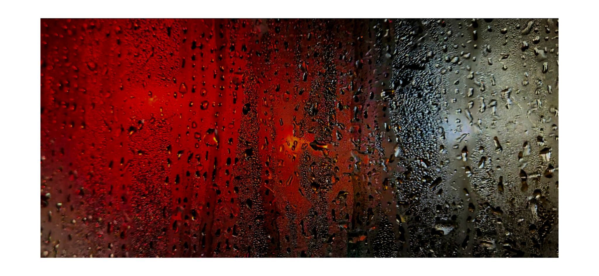A photo of steamed up window looking out onto a blurred high street