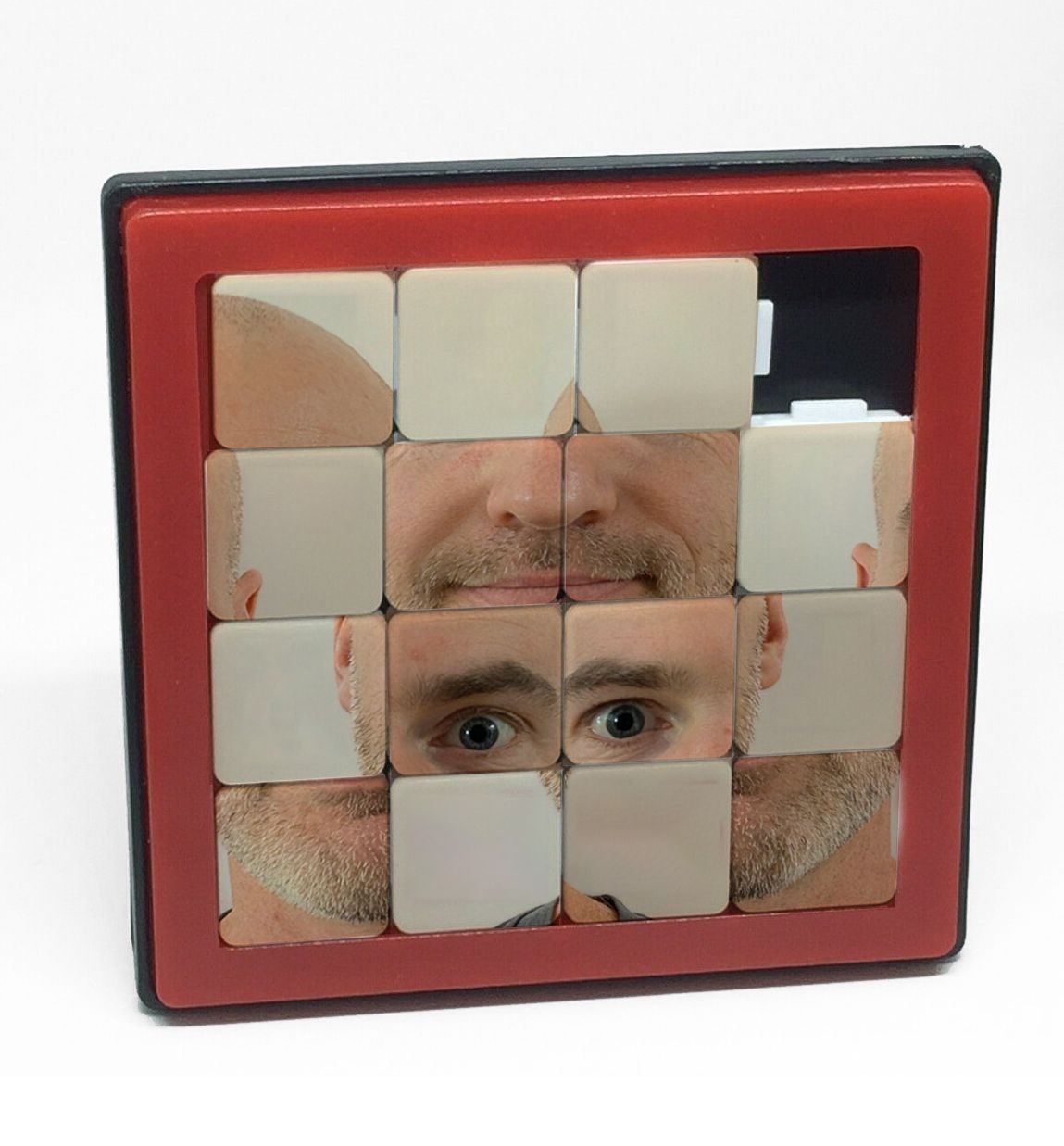 A sliding puzzle of my smiling face is all jumbled up.