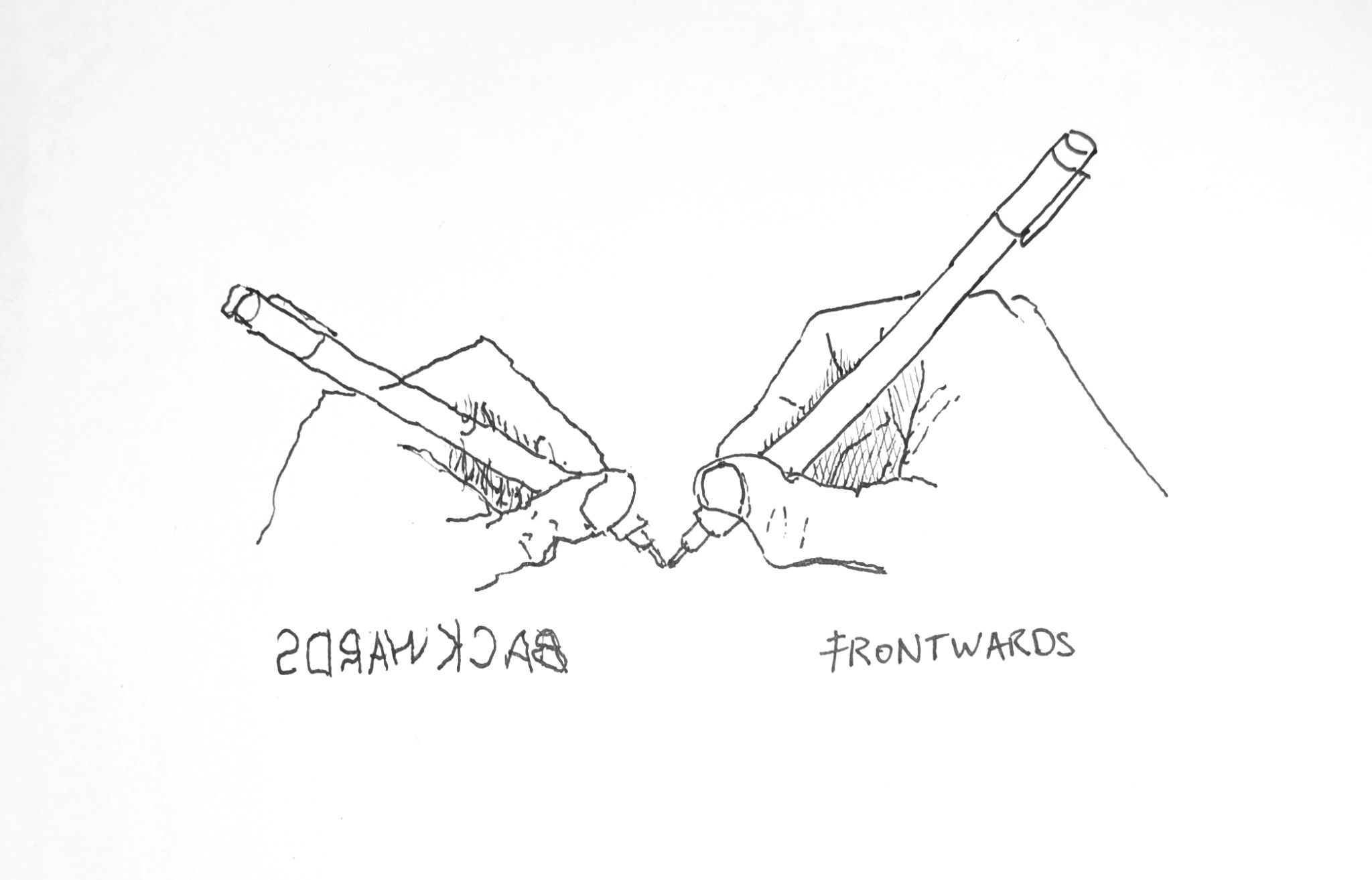 Two hands holding pens are drawn. They are mirror images of one another. The hand on the right was drawn by my right hand. The hand on the left was drawn by my left hand.