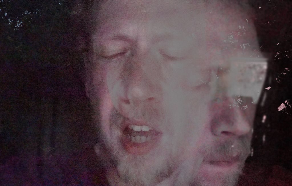 grainy digital layering of two portrait photographs of a wincing face in motion