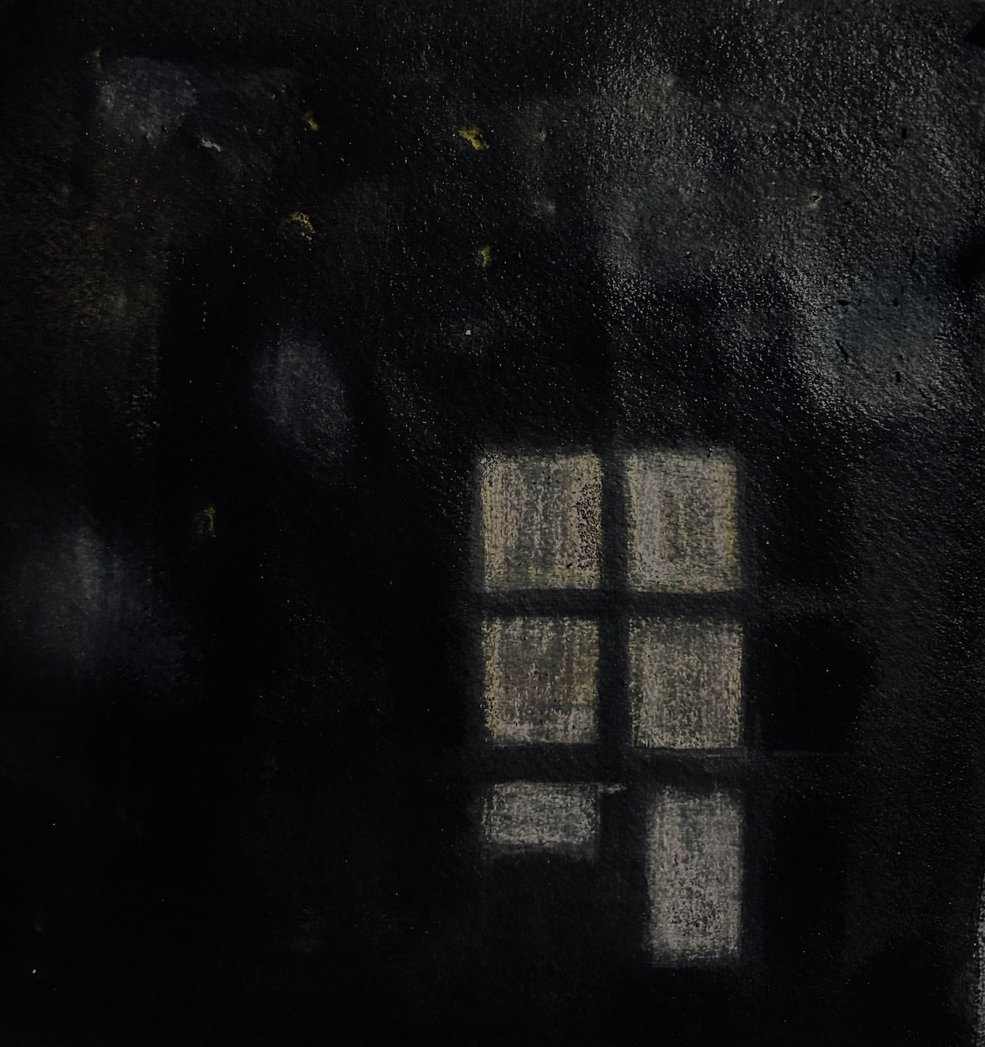 a pattern of white/yellow squares that look a bit like windows on a very black background