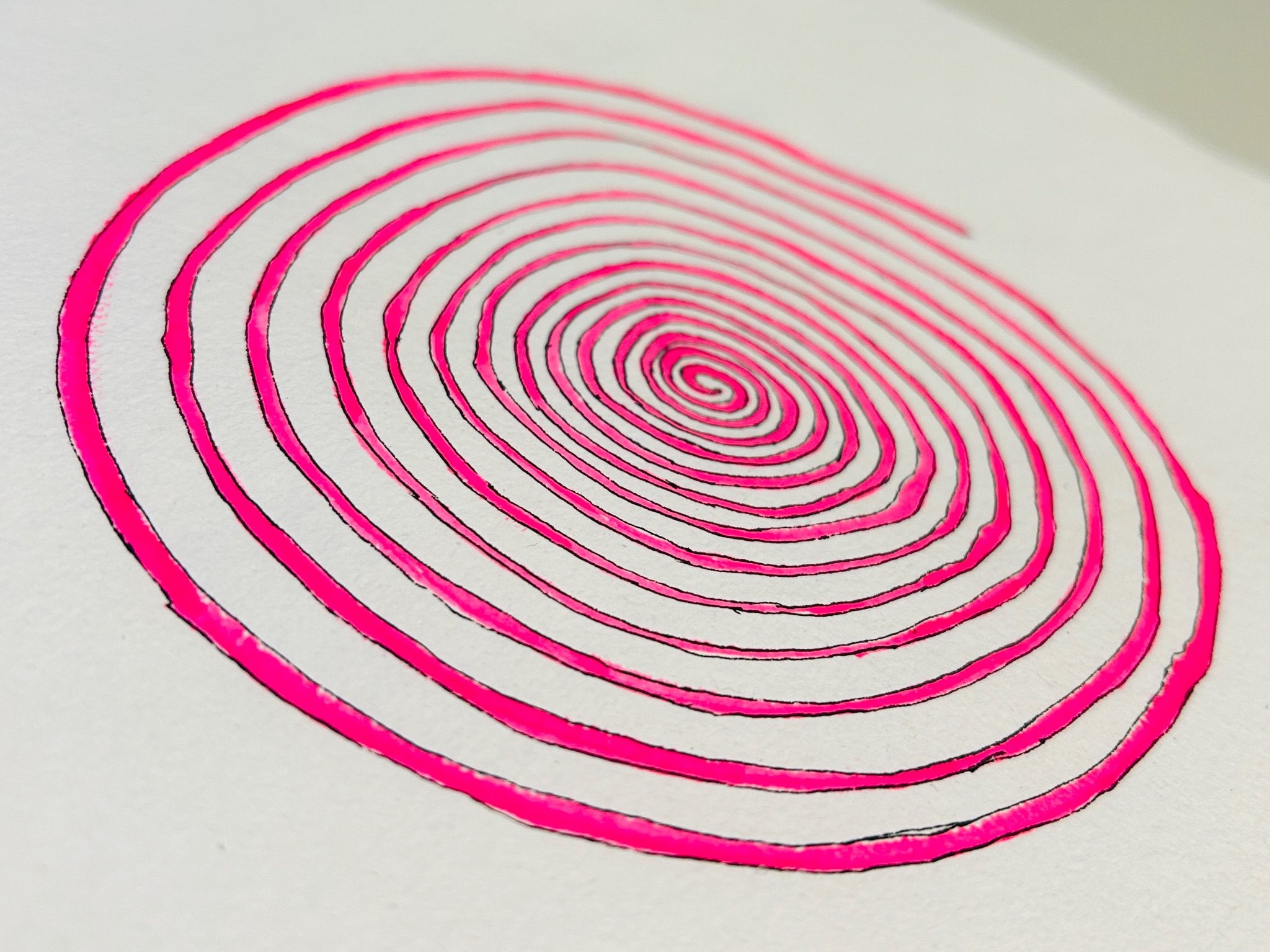 Pink spiral with black outline