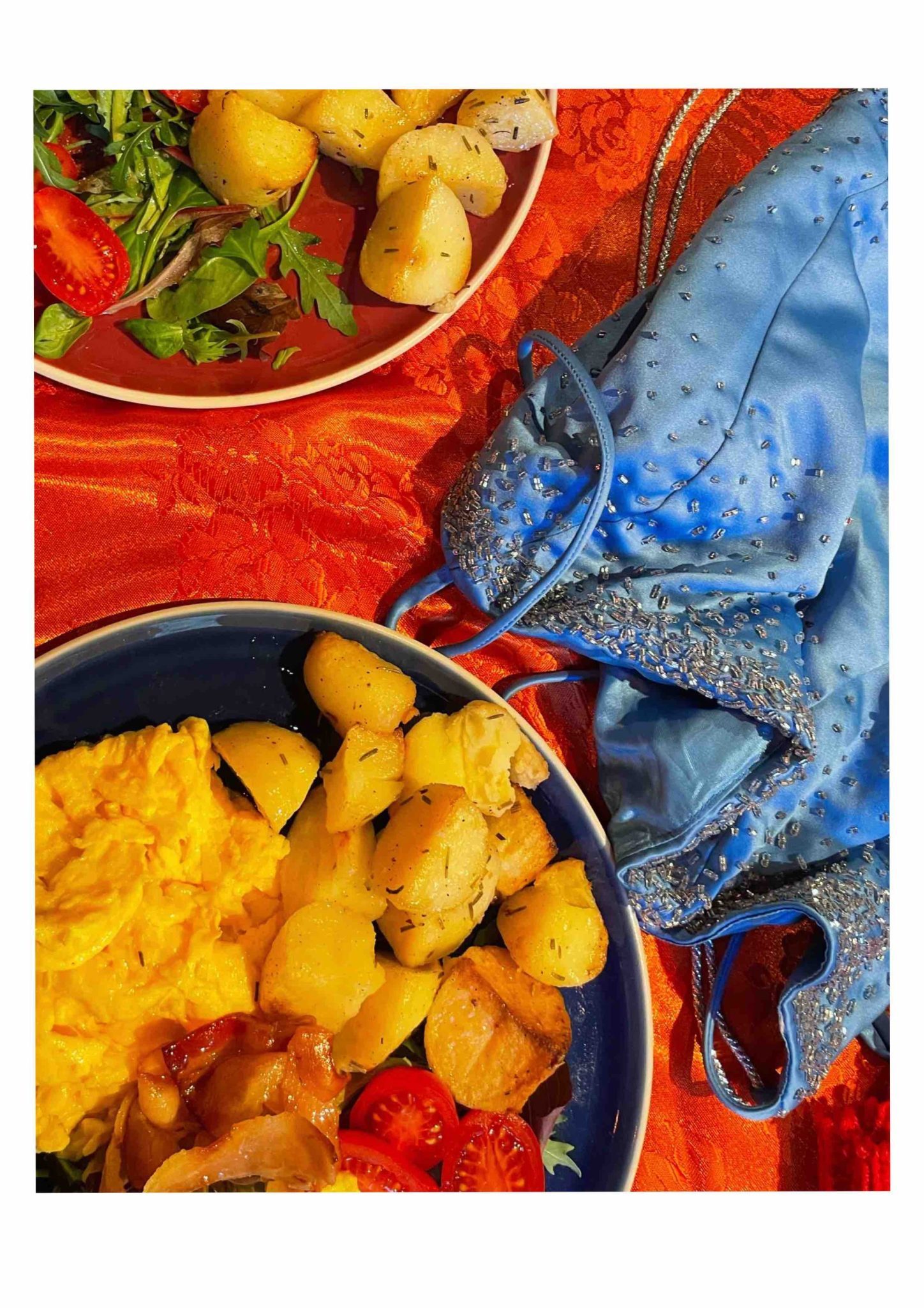 Photo of roast potatoes and a blue dress