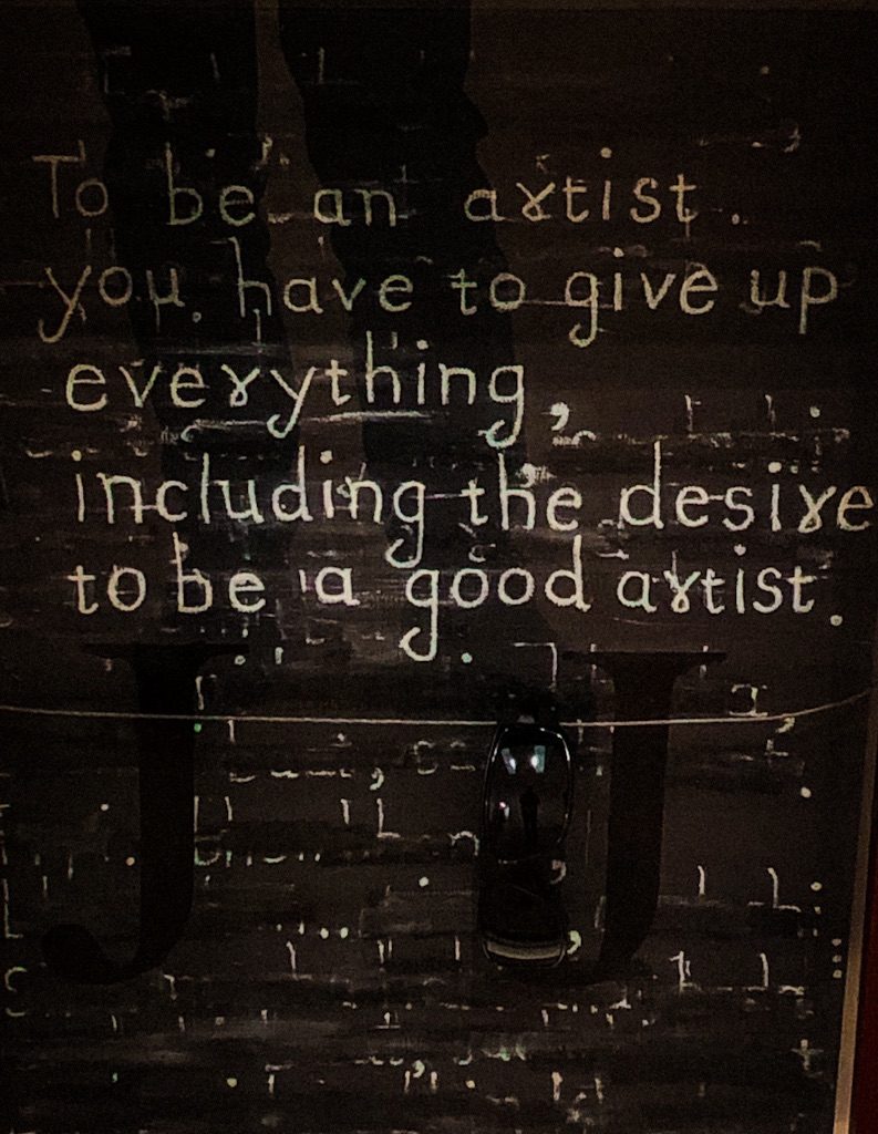 A photo of a sign about how to be an artist