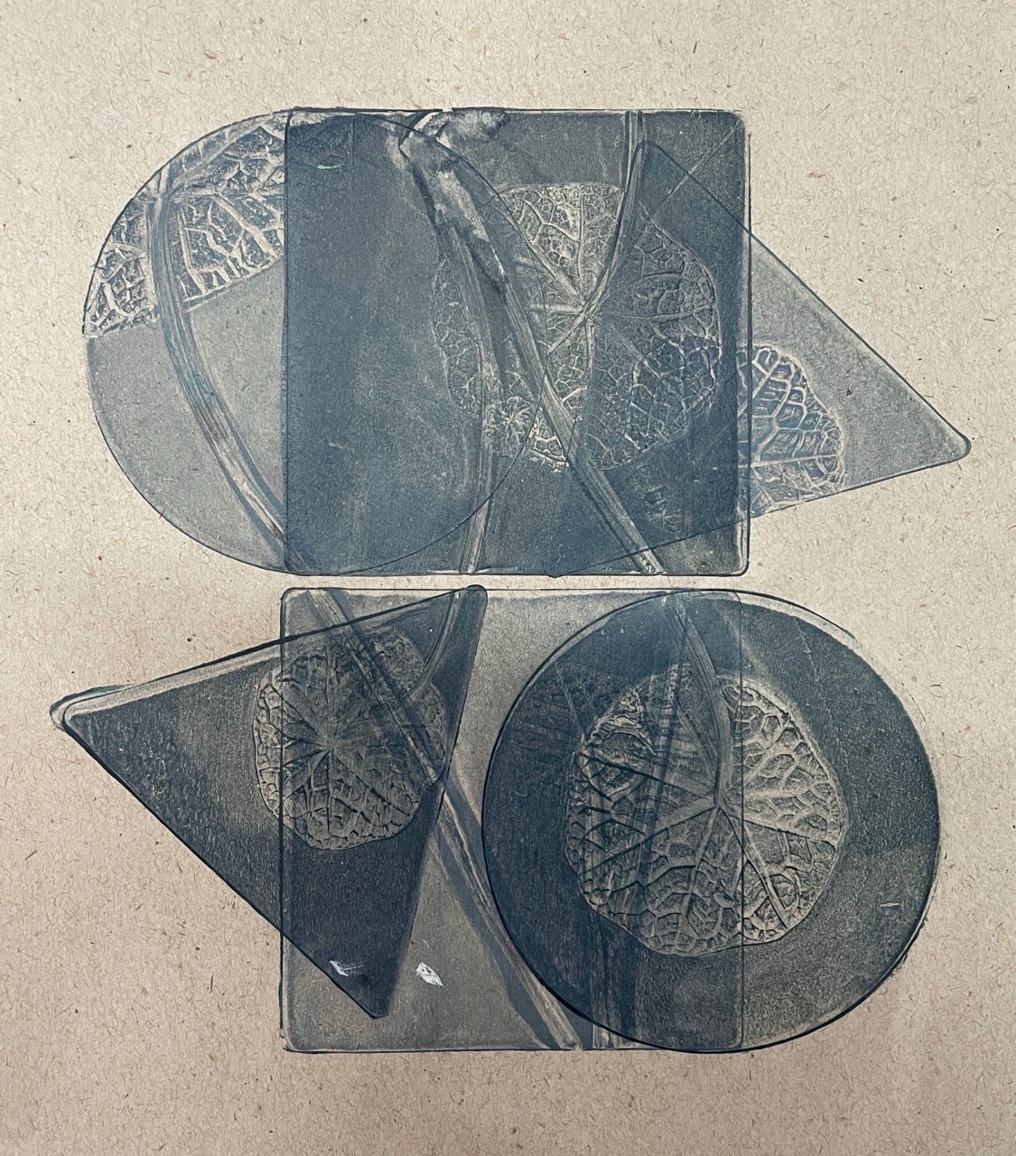 Geometric gelatin plate prints on recycled paper with plants, overlapping shapes of botanicals in dark blue