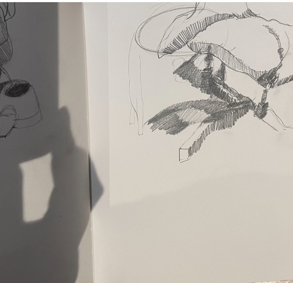 A pencil drawing of shadows under a chair and a shadow of a hand overlaid