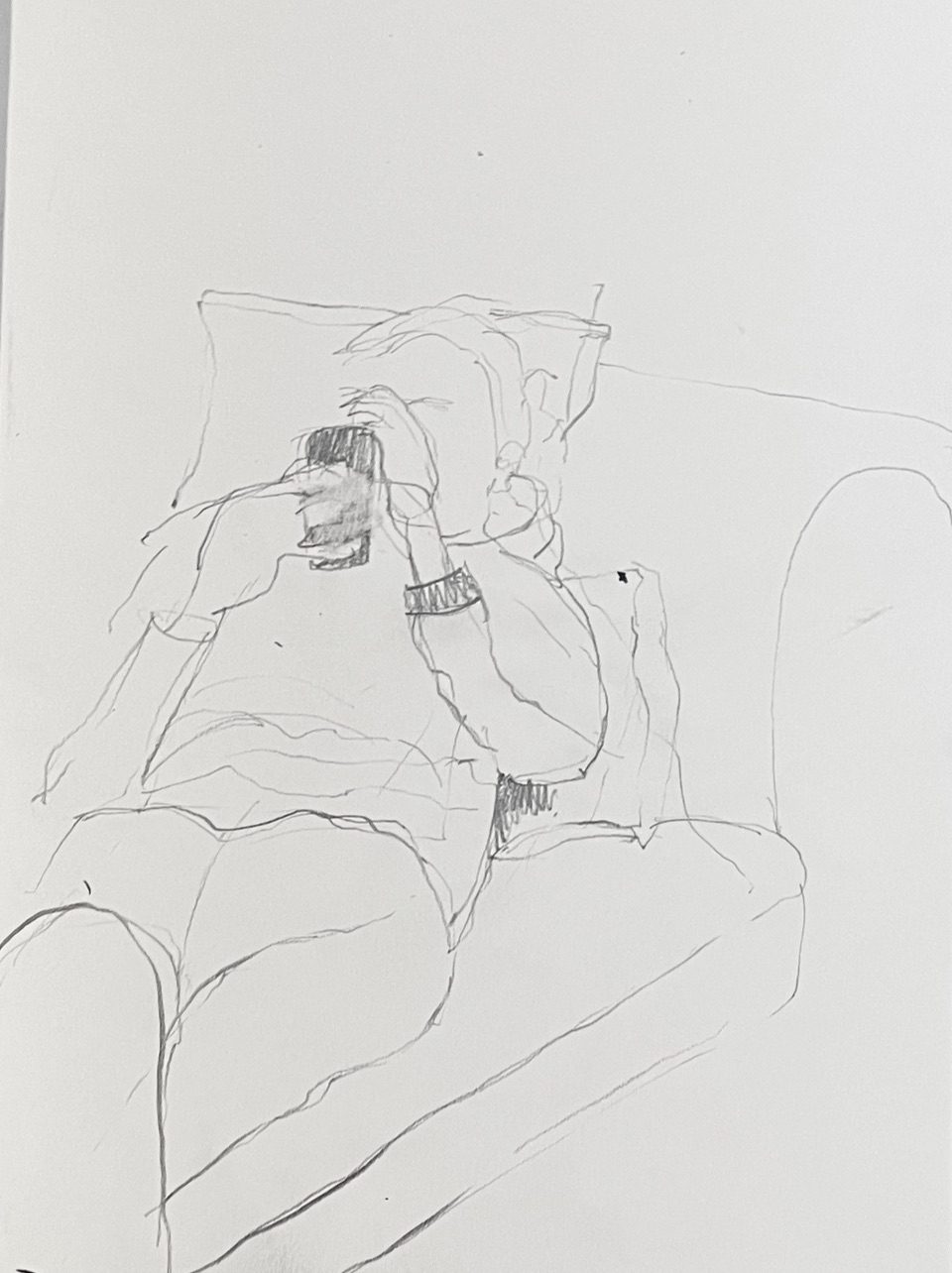 Line drawing of a reclining person an a phone