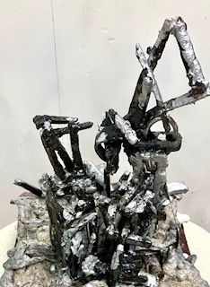 raku fired in charcoal stoneware with black glazed wild clay structure