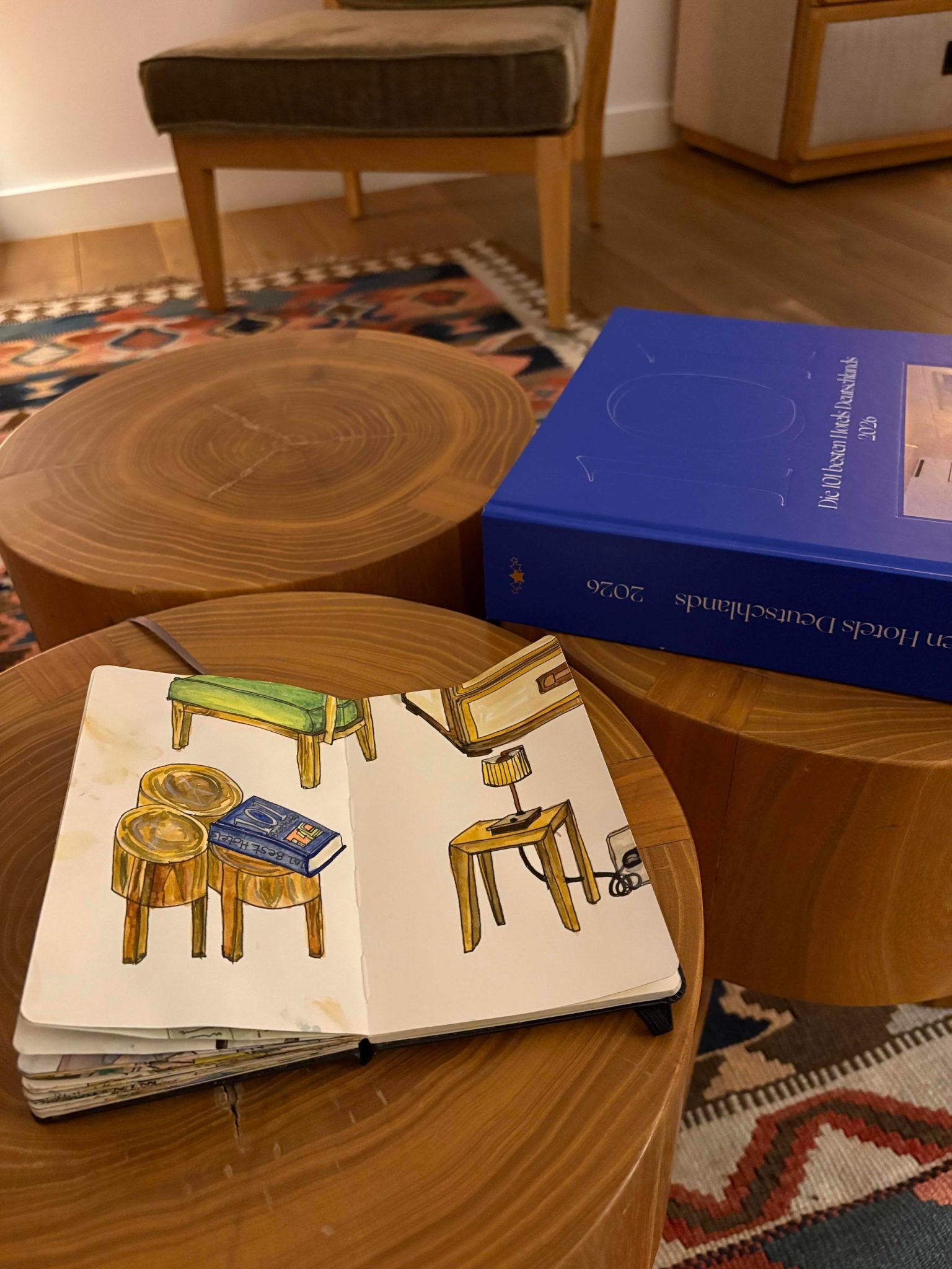 Watercolour of stools, chair, cupboard, side table and lamp