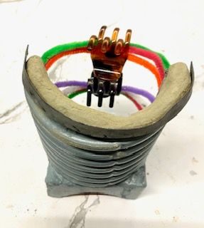 clay, brick, rubber, pipecleaners and hair clips